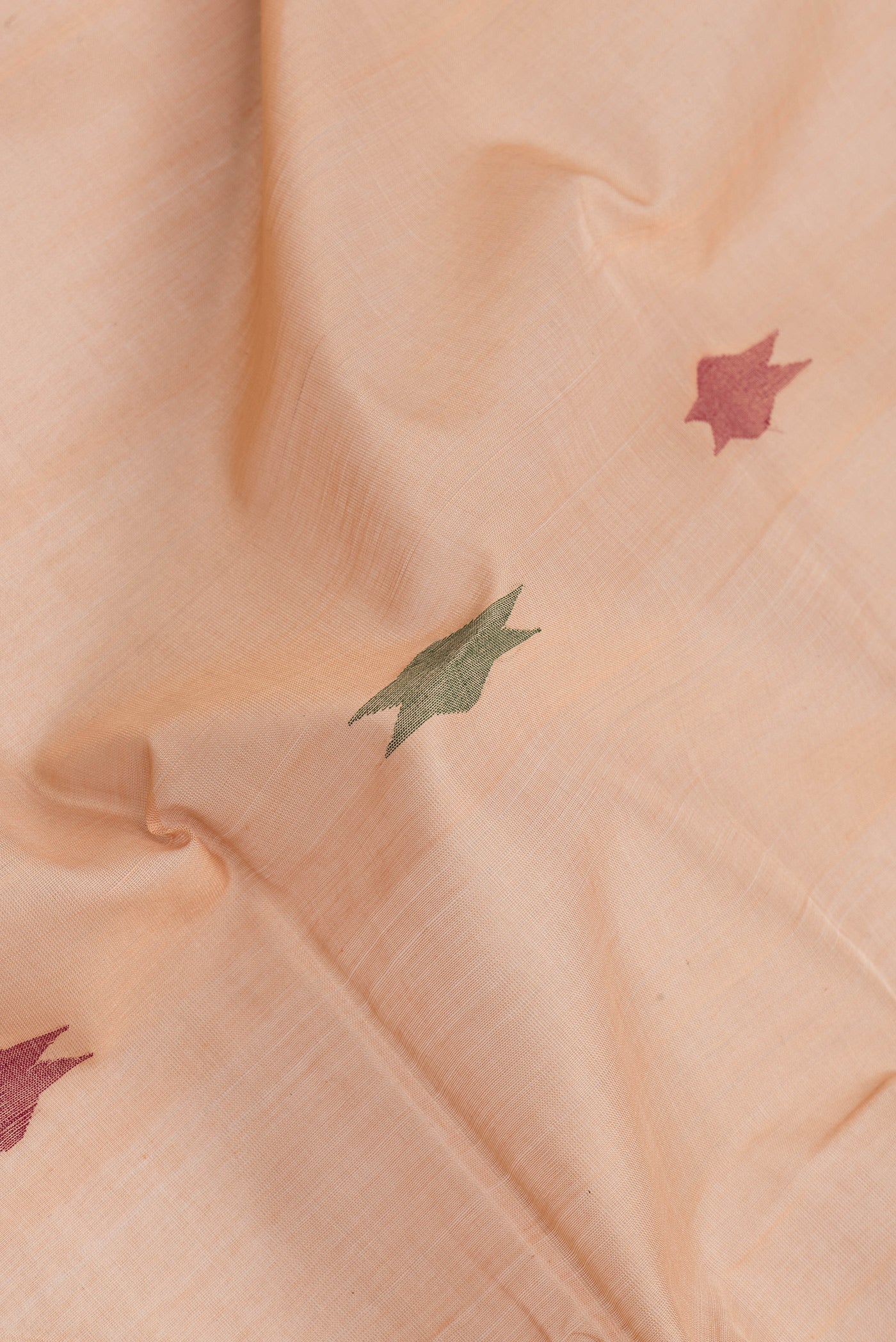 Close up of Sandal Dual Tone Uppada Cotton Saree with Zari And Thread Butta on the body and Zari Border.  displaying folds