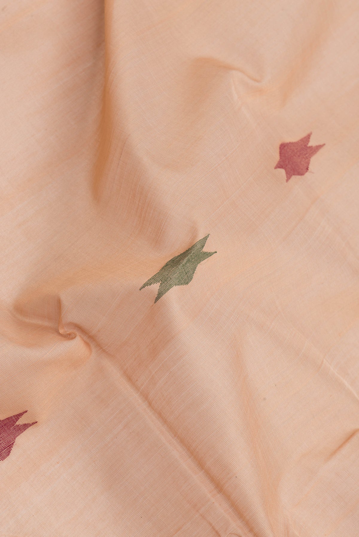 Close up of Sandal Dual Tone Uppada Cotton Saree with Zari And Thread Butta on the body and Zari Border.  displaying folds