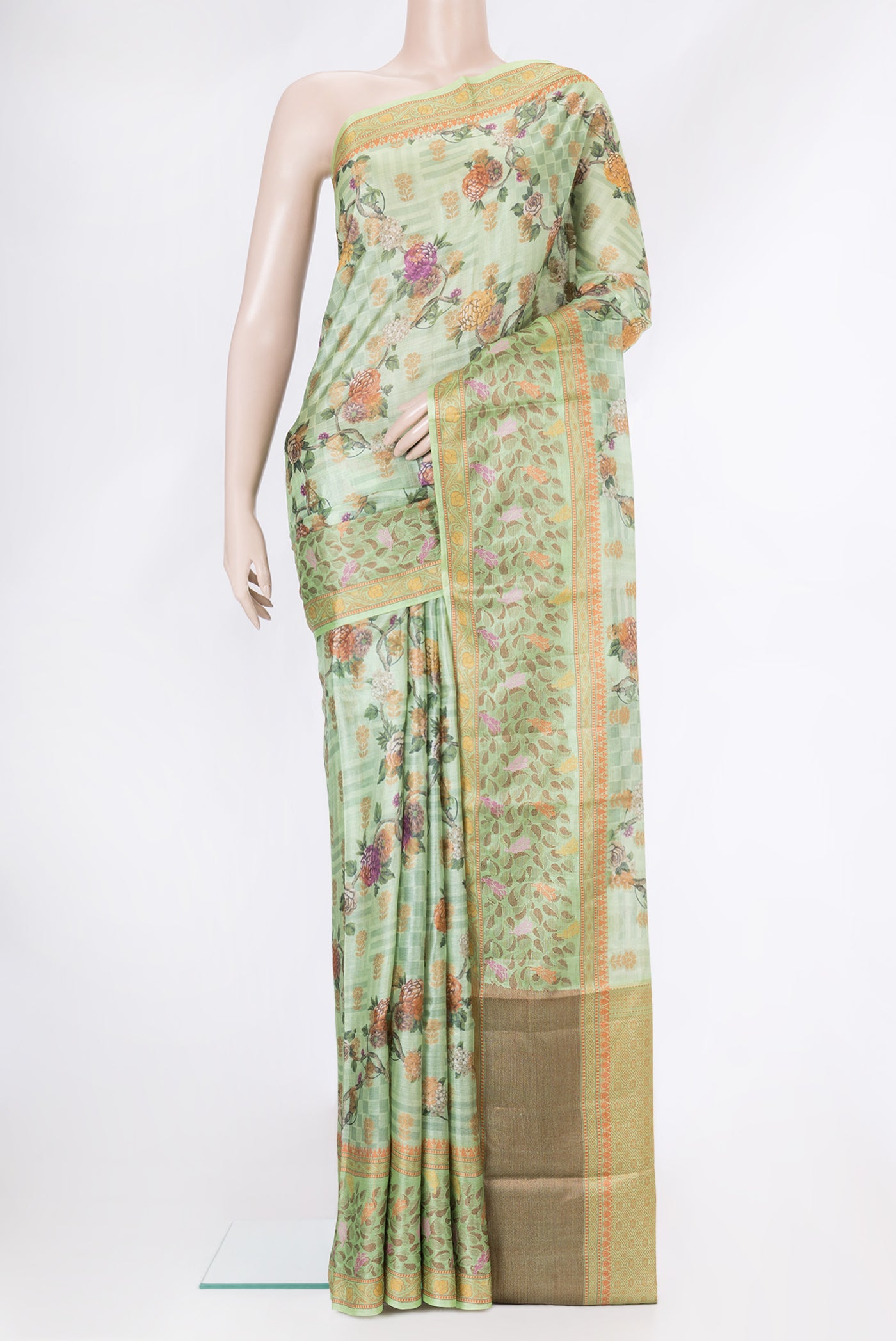 Pista Green Dual Tone Tussar Silk Saree with Printed design on the body and Thread Border.  displayed on a mannequin