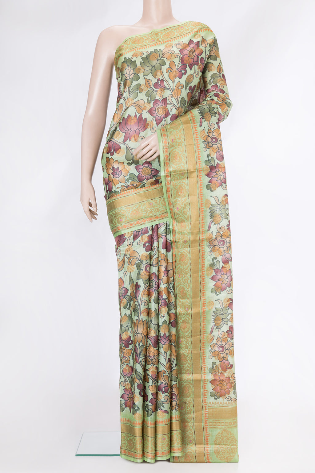 Pista Green Dual Tone Tussar Silk Saree with Printed design on the body and Thread Border.  displayed on a mannequin