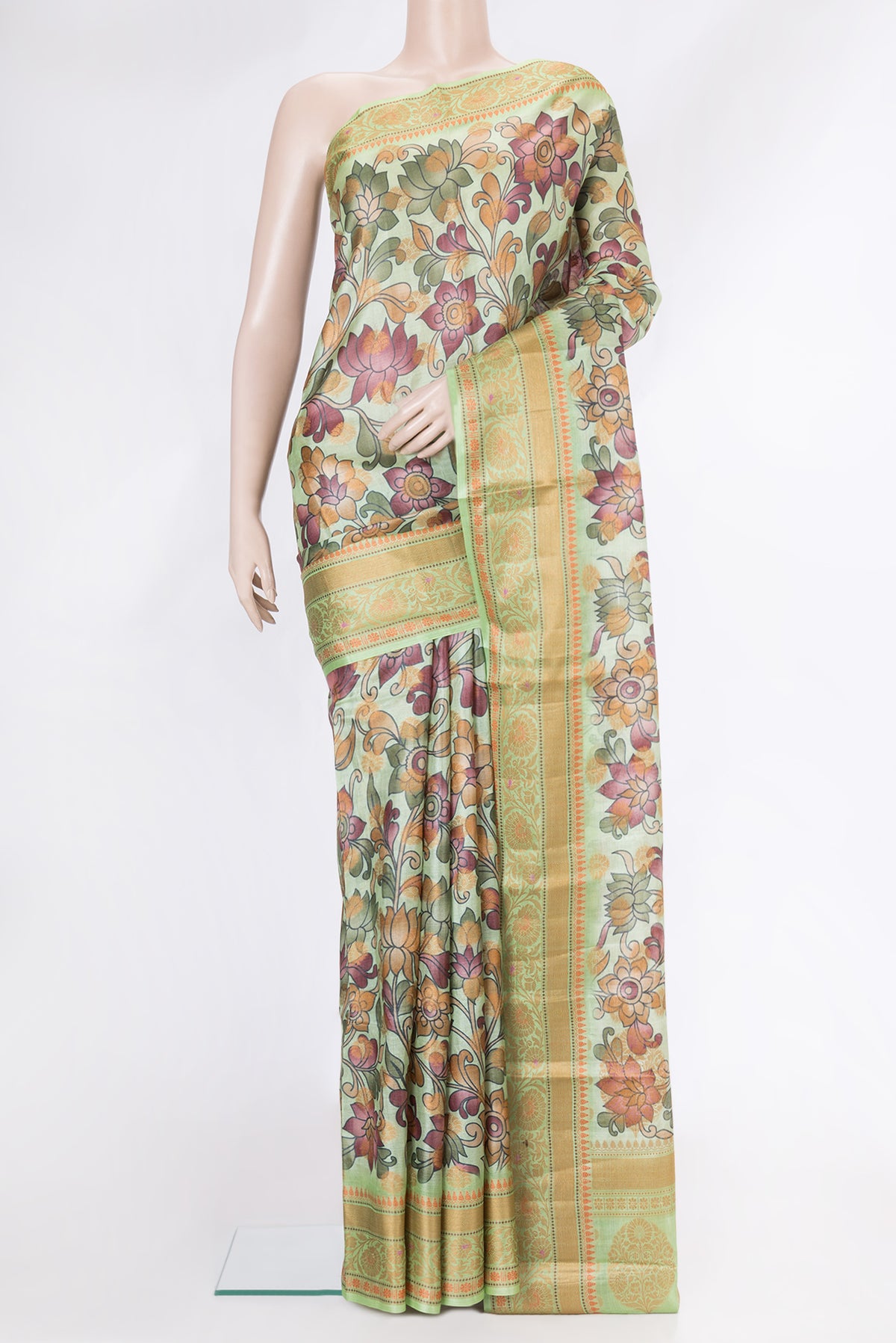 Pista Green Dual Tone Tussar Silk Saree with Printed design on the body and Thread Border.  displayed on a mannequin