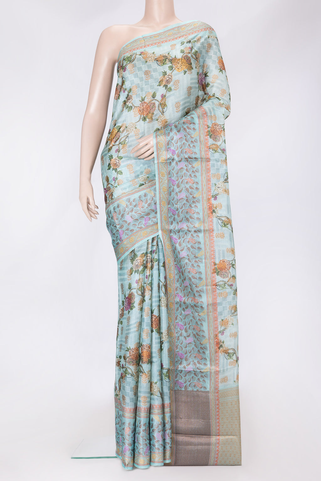 Sky Blue Dual Tone Tussar Silk Saree with Printed design on the body and Thread Border.  displayed on a mannequin