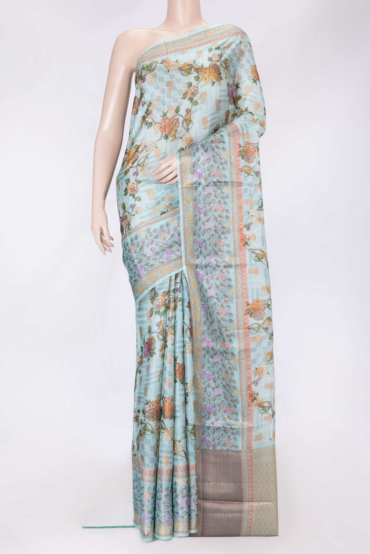 Sky Blue Dual Tone Tussar Silk Saree with Printed design on the body and Thread Border.  displayed on a mannequin