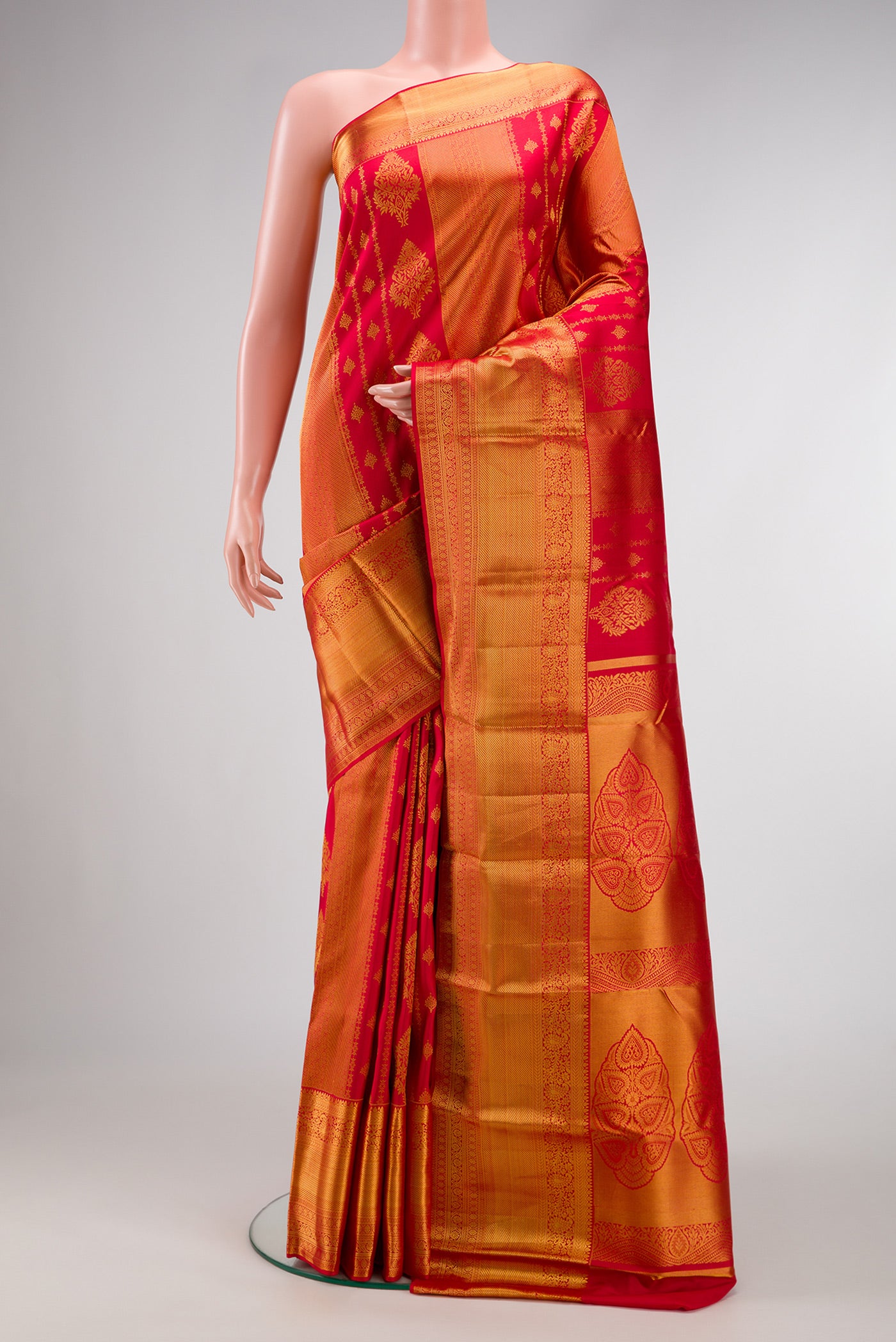 Dark Pink Dual Tone Kanjivaram Silk Saree with Zari Brocade on the body and Zari Border.  displayed on a mannequin
