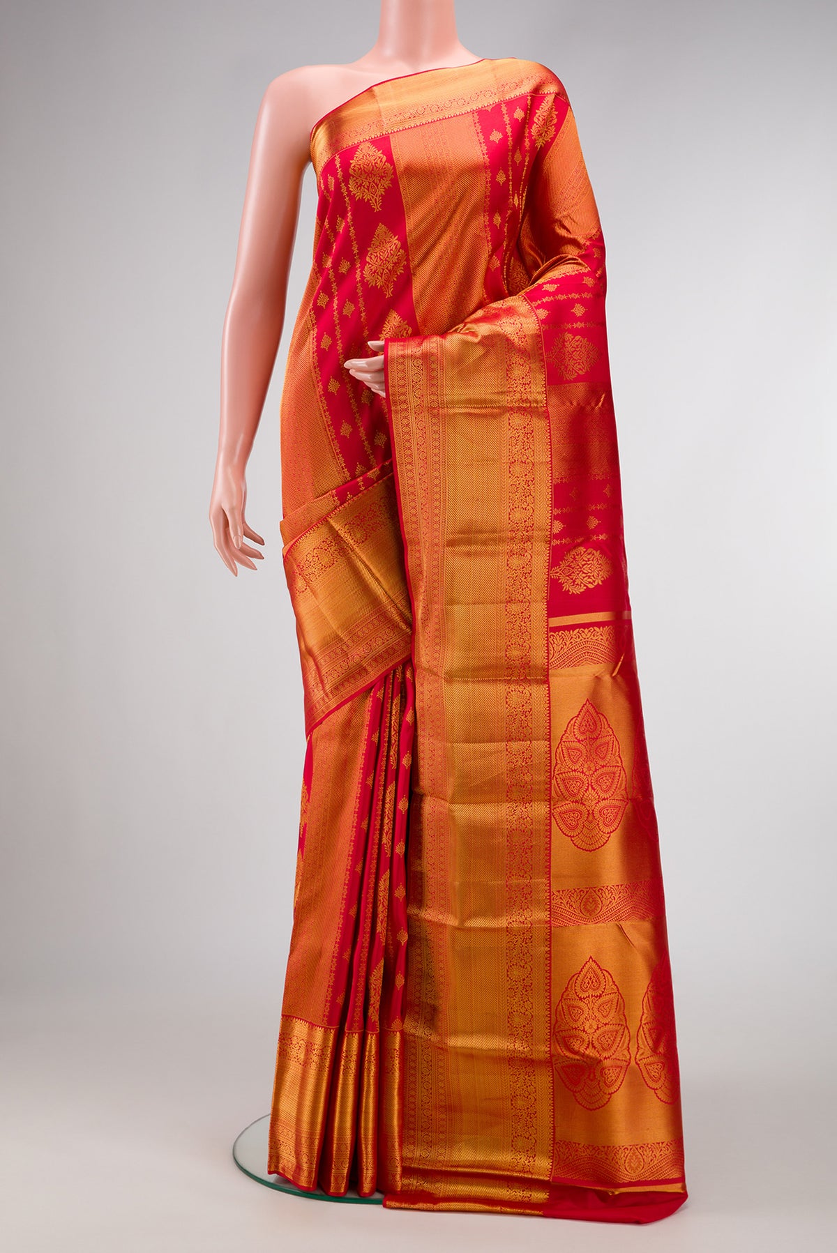 Dark Pink Dual Tone Kanjivaram Silk Saree with Zari Brocade on the body and Zari Border.  displayed on a mannequin