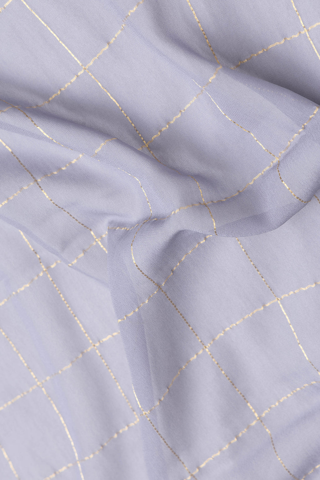 Close up of Grey Dual Tone Georgette Saree with Checked design on the body and Zari Border.  displaying folds