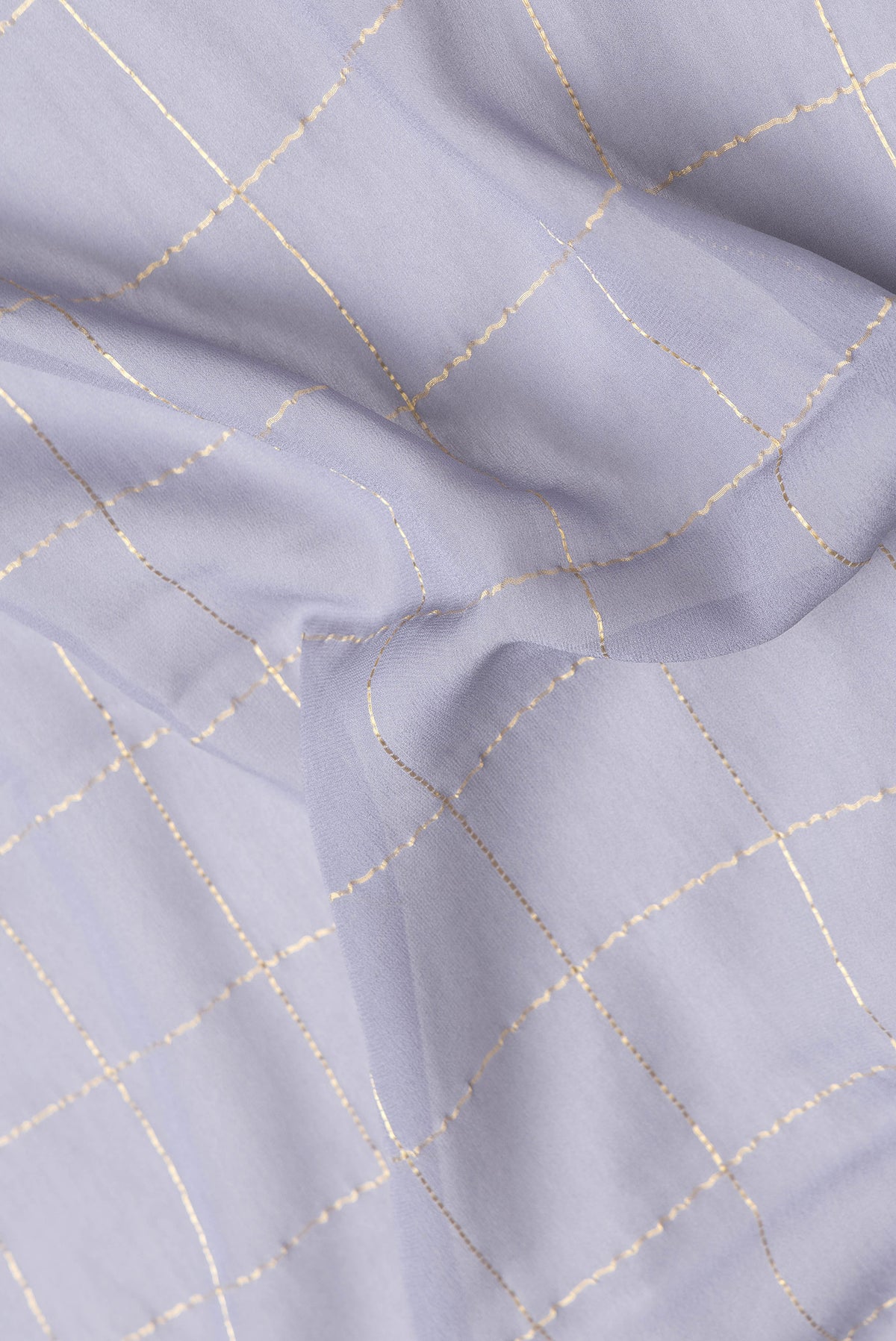 Close up of Grey Dual Tone Georgette Saree with Checked design on the body and Zari Border.  displaying folds