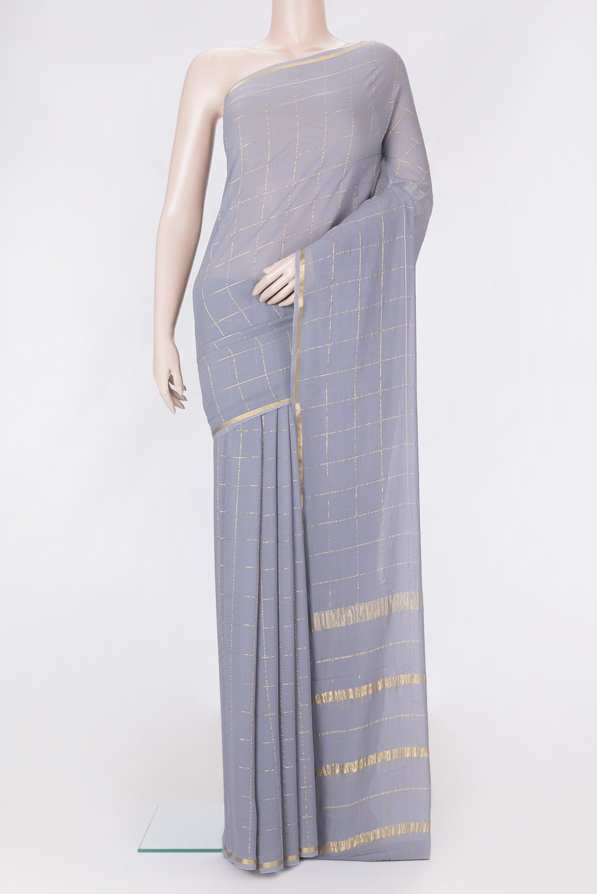 Grey Dual Tone Georgette Saree with Checked design on the body and Zari Border.  displayed on a mannequin