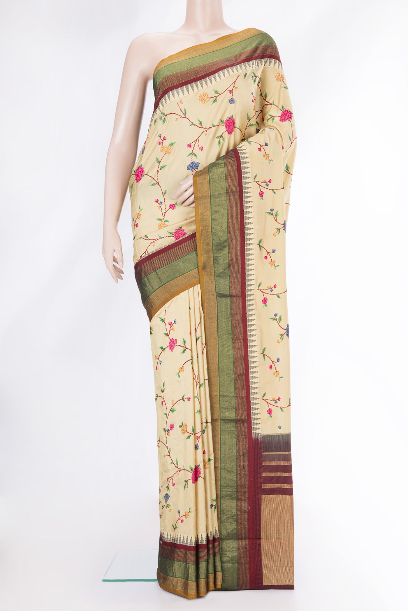 Beige Dual Tone Kanjivaram Silk Saree with Embroidery on the body and Zari Border.  displayed on a mannequin