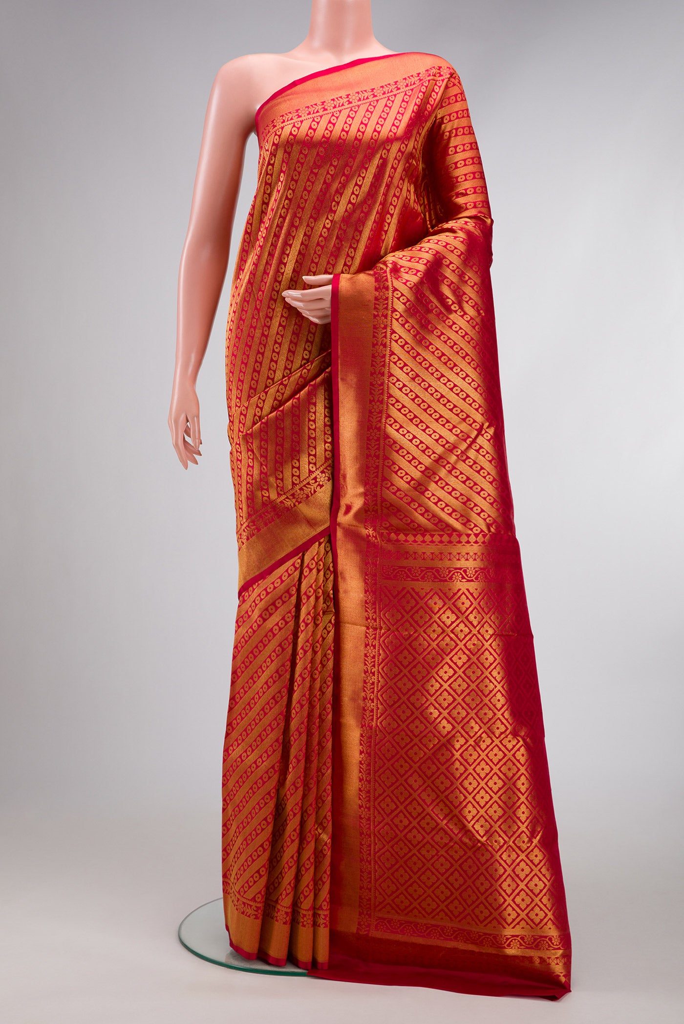 Maroon Dual Tone Kanchipuram Silk Saree with Zari Brocade on the body and Zari Border.  displayed on a mannequin
