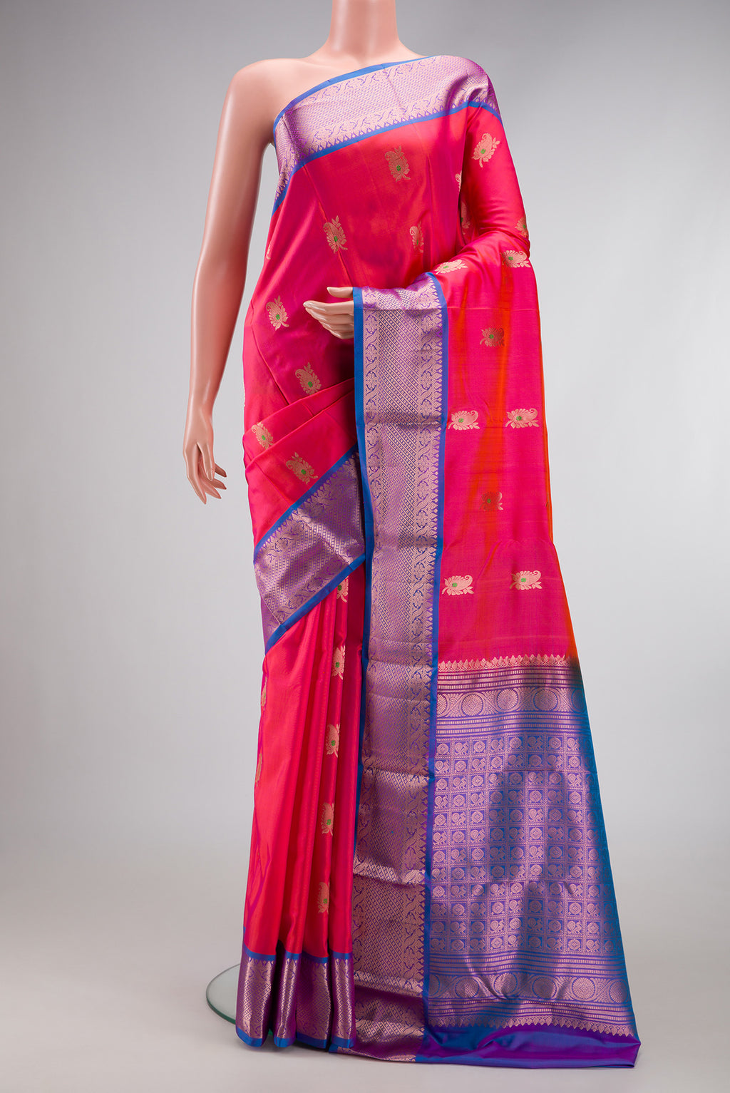 Coral Dual Tone Kanjivaram Silk Nine Yards Saree with Zari And Thread Butta on the body and Zari Border.  displayed on a mannequin