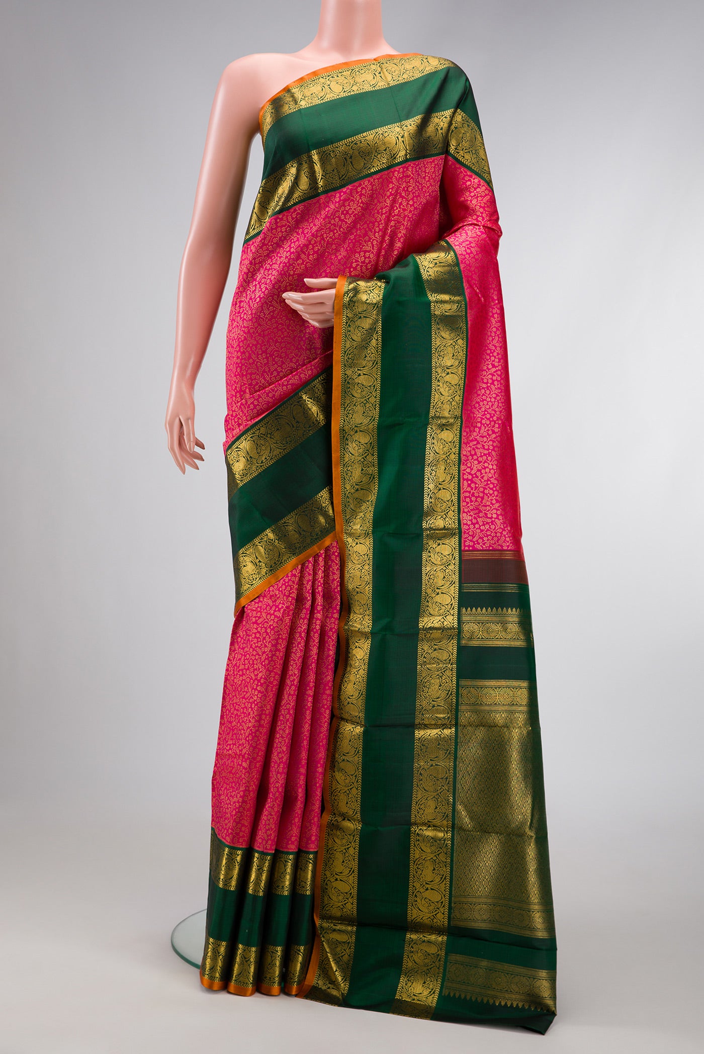 Dark Pink Dual Tone Kanchipuram Silk Saree with Zari Brocade on the body and Zari Border.  displayed on a mannequin