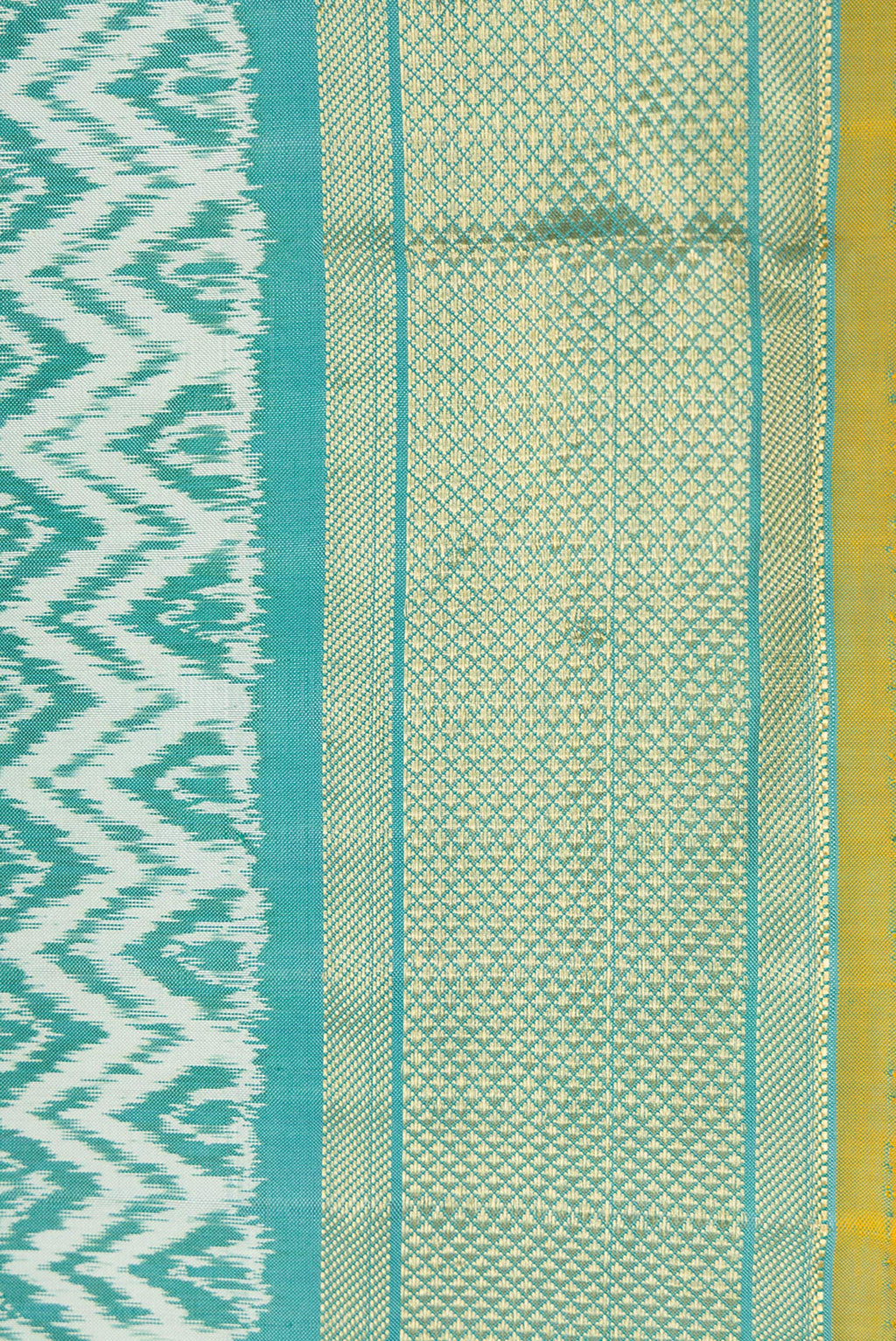 Border image of Blue Dual Tone Double Ikat Saree with Ikat Print on the body and Zari Border. 
