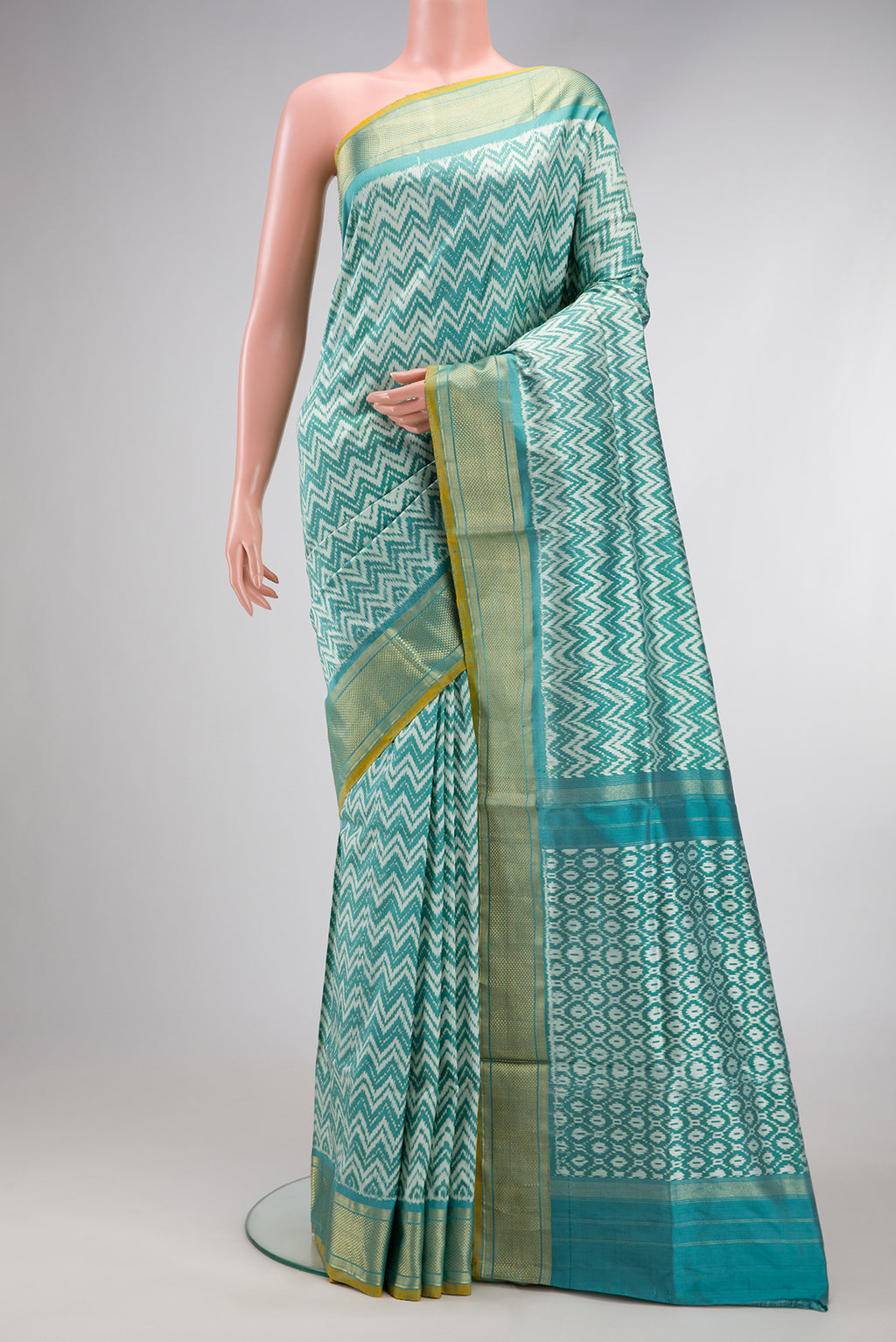 Blue Dual Tone Double Ikat Saree with Ikat Print on the body and Zari Border.  displayed on a mannequin
