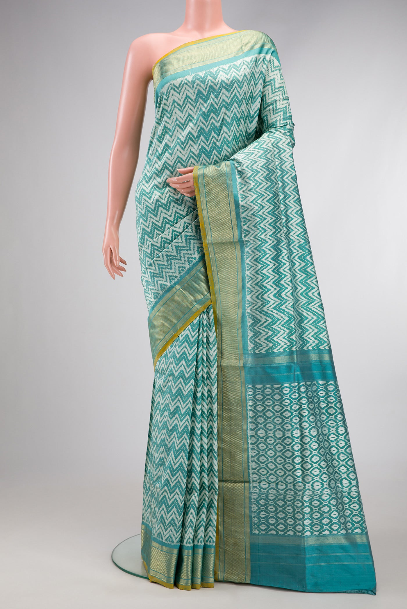 Blue Dual Tone Double Ikat Saree with Ikat Print on the body and Zari Border.  displayed on a mannequin