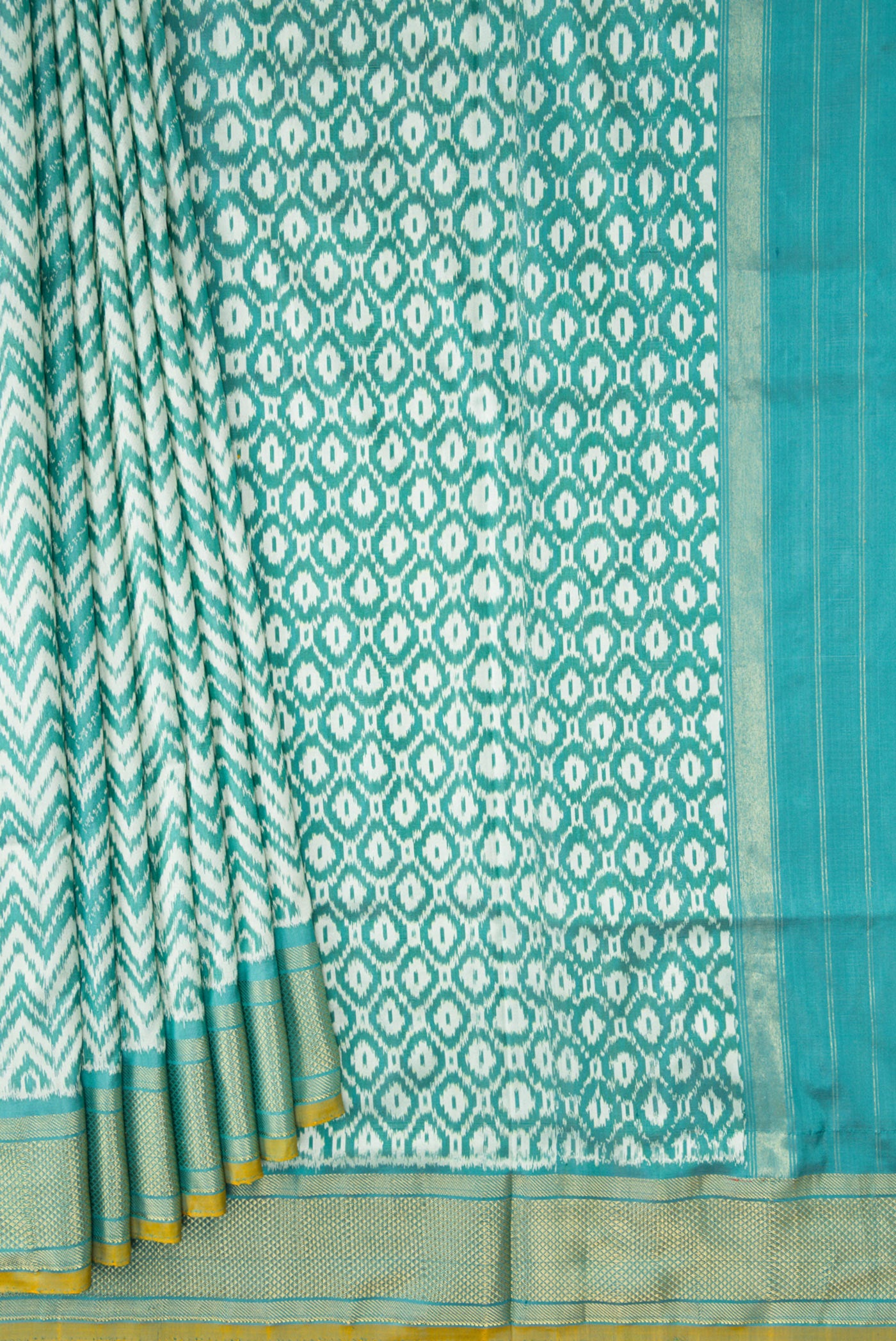 Pleats and pallu of Blue Dual Tone Double Ikat Saree with Ikat Print on the body and Zari Border. 
