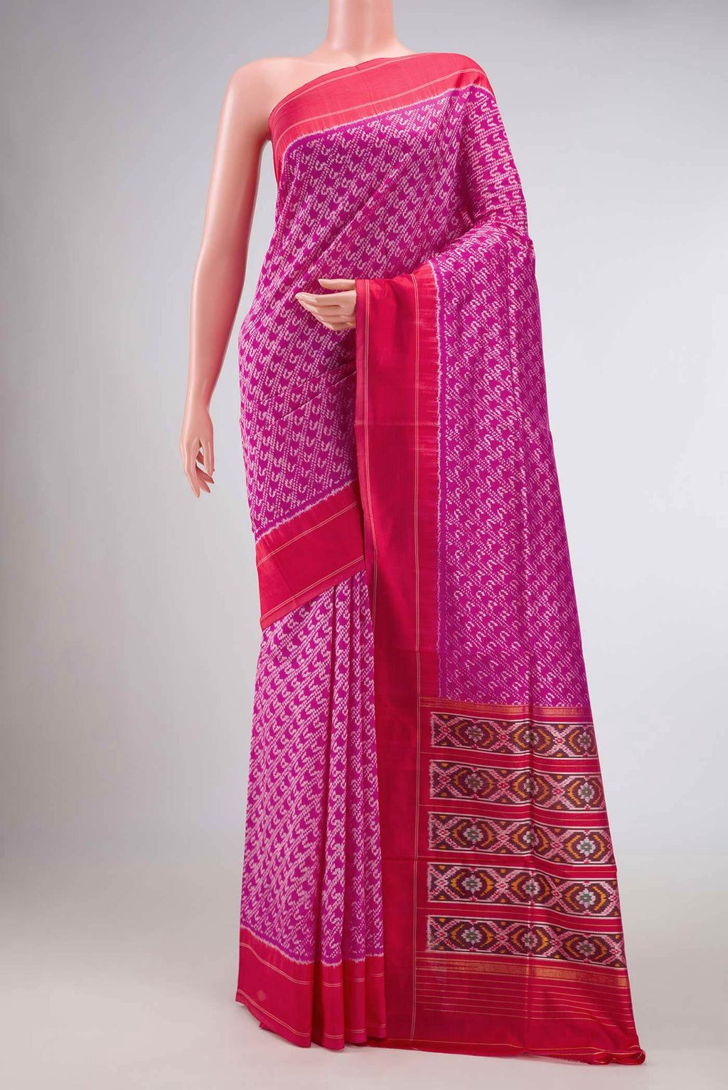 Pink Dual Tone Rajkot Patola Silk Saree with Ikat Print on the body and Plain Border displayed on a mannequin