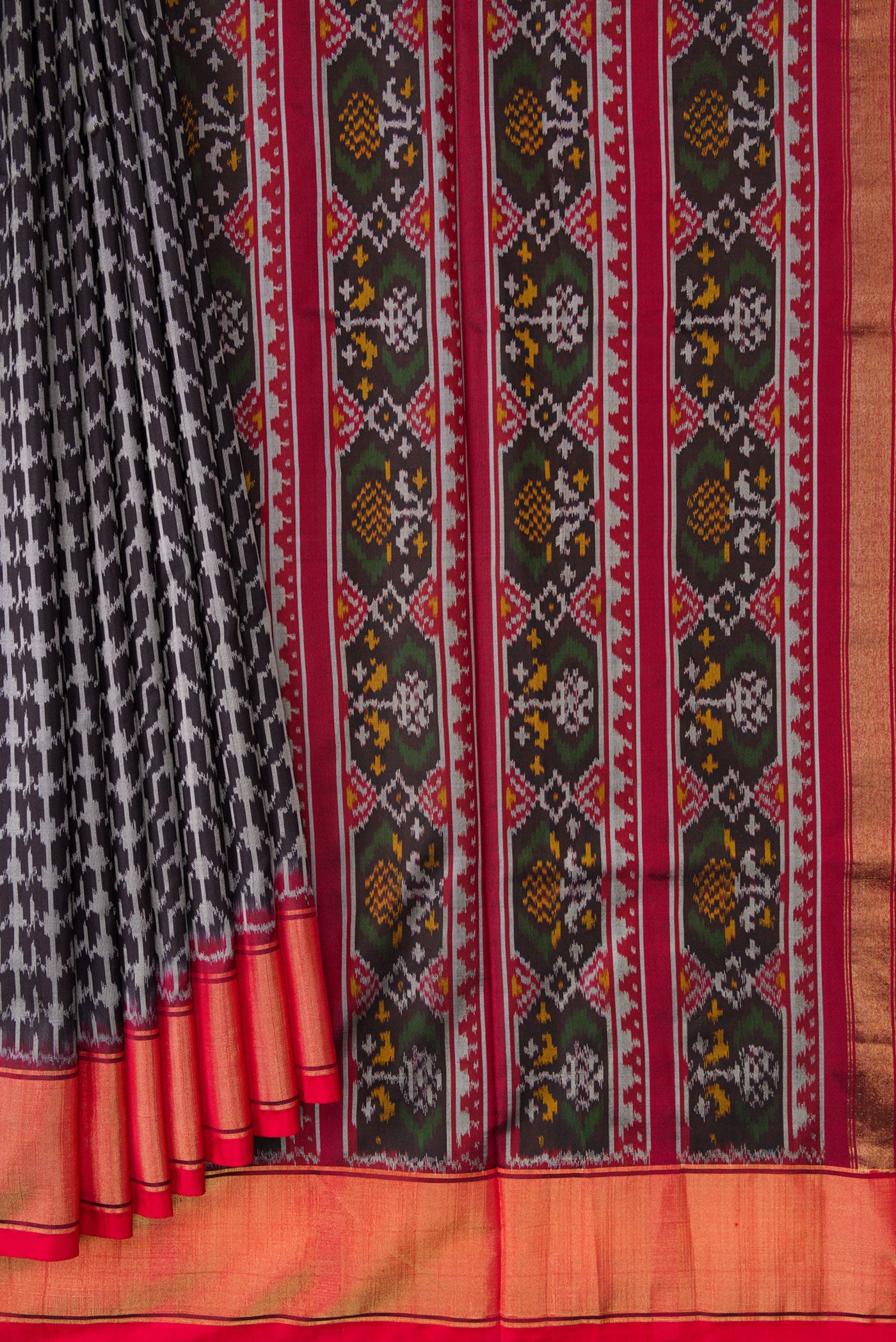 Pleats and pallu of Black Dual Tone Double Ikat Saree with Ikat Print on the body and Zari Border. 