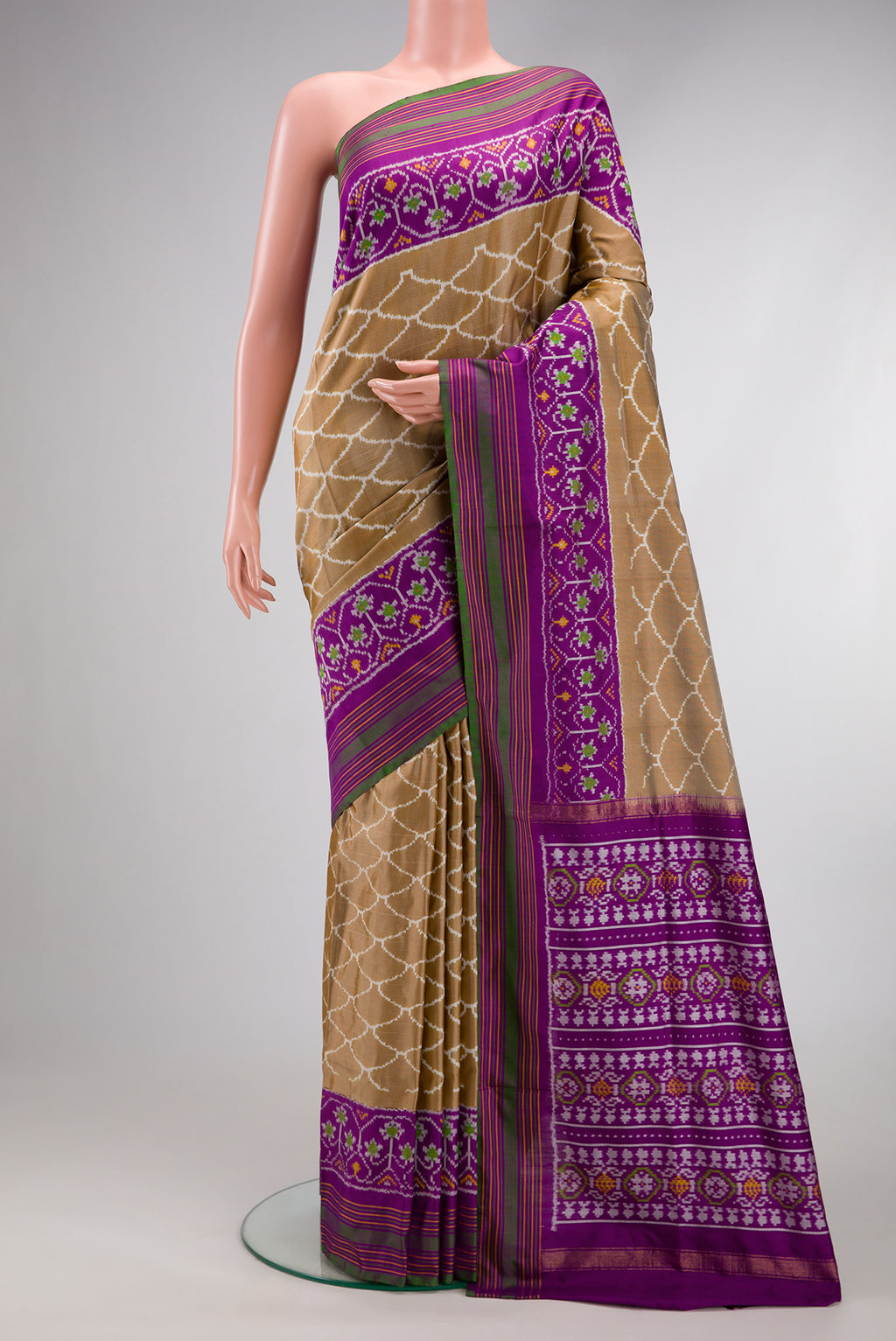Dark Beige Dual Tone Double Ikat Saree with Ikat Print on the body and Ikat Border.  displayed on a mannequin
