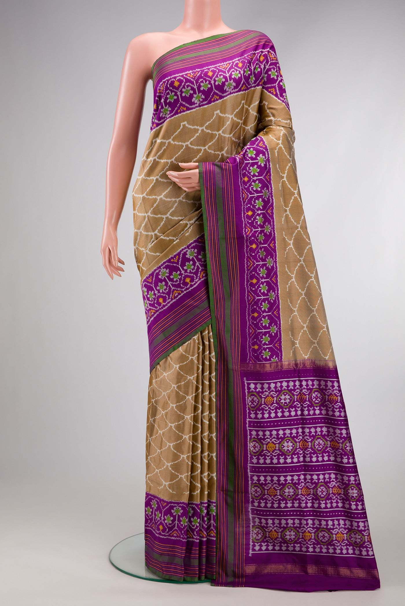 Dark Beige Dual Tone Double Ikat Saree with Ikat Print on the body and Ikat Border.  displayed on a mannequin