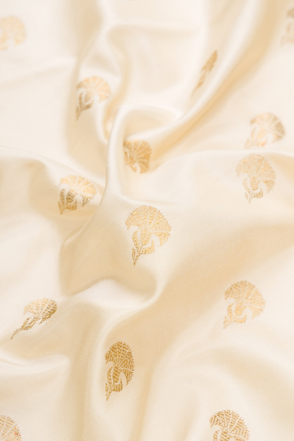 Close up of Sandal Dual Tone Double Ikat Saree with Zari Butta on the body and Paithani Border.  displaying folds