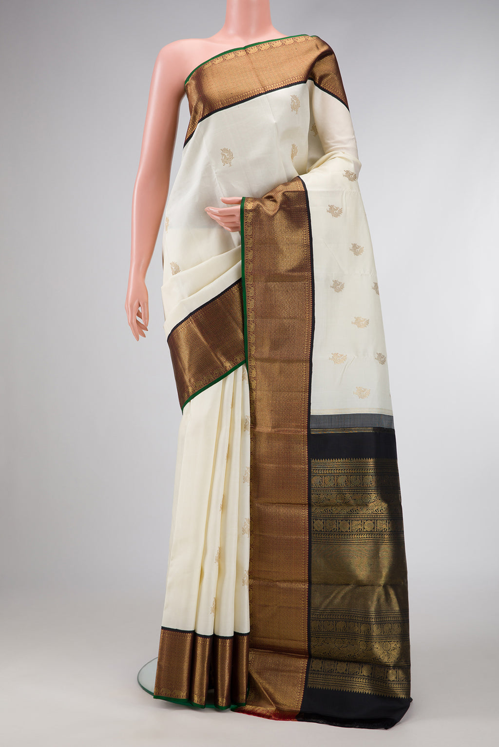 Pure Silk Pure Zari Off White Dual Tone Kanchipuram Saree with Zari Butta on the body and Zari Border.  displayed on a mannequin