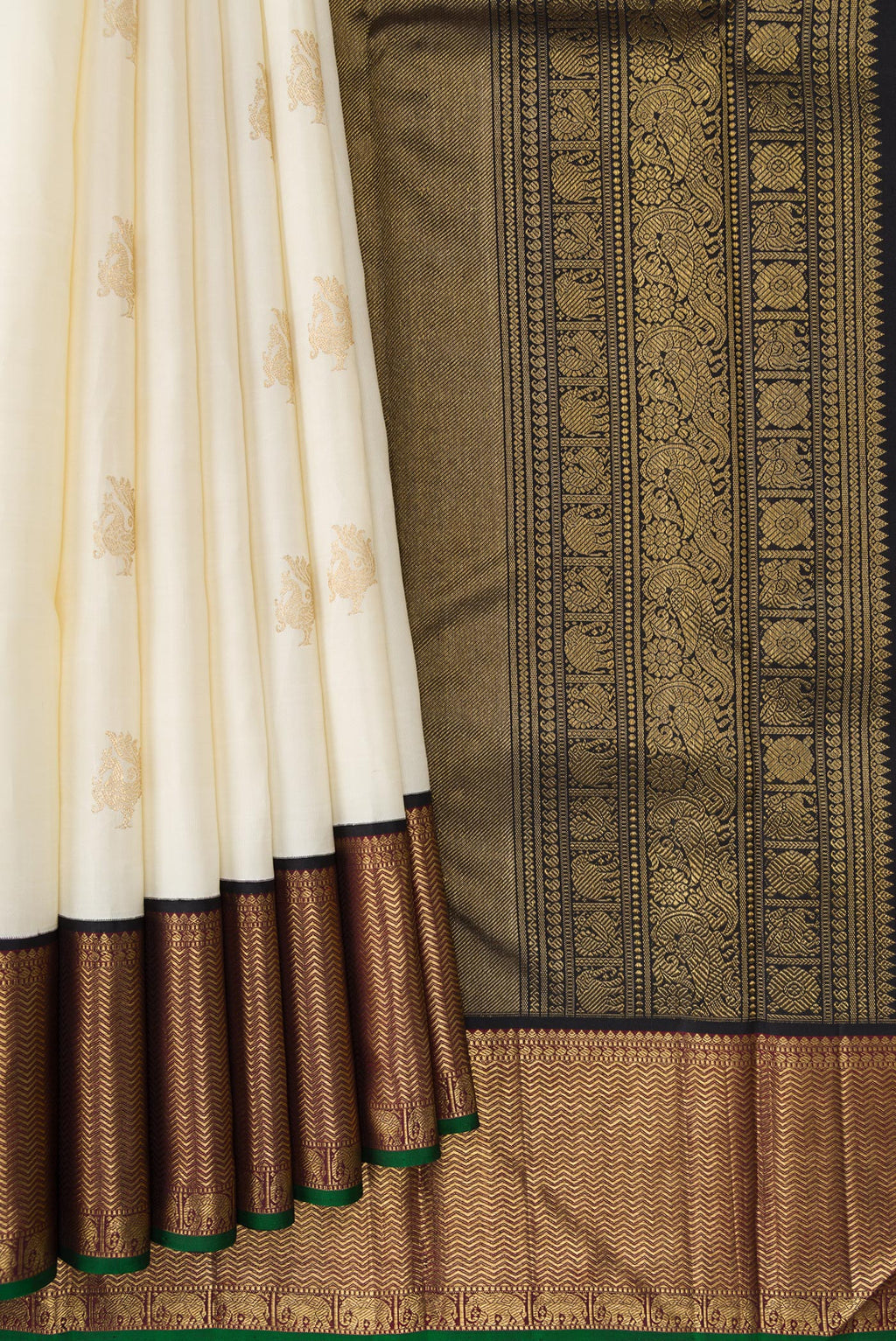 Pleats and pallu of Pure Silk Pure Zari Off White Dual Tone Kanchipuram Saree with Zari Butta on the body and Zari Border. 