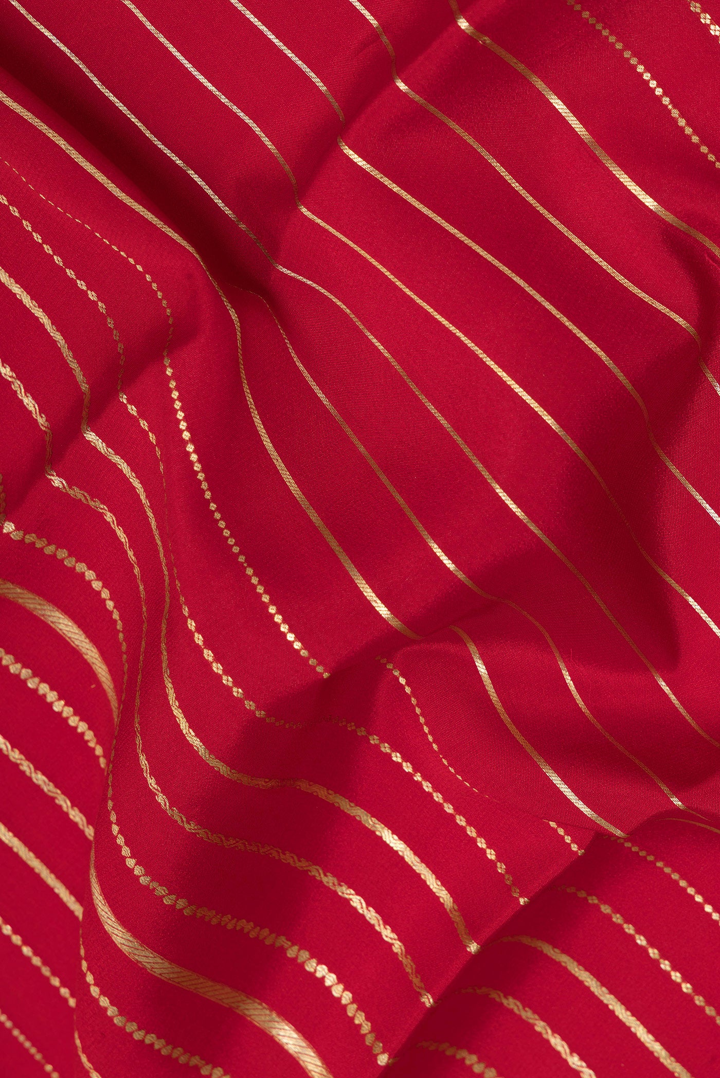 Close up of Maroon Mysore Silk Saree with Stripes on the body and Zari Border.  displaying folds