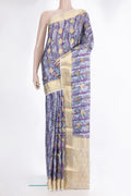 Grey Crepe Saree with Printed design on the body and Zari Border.  displayed on a mannequin