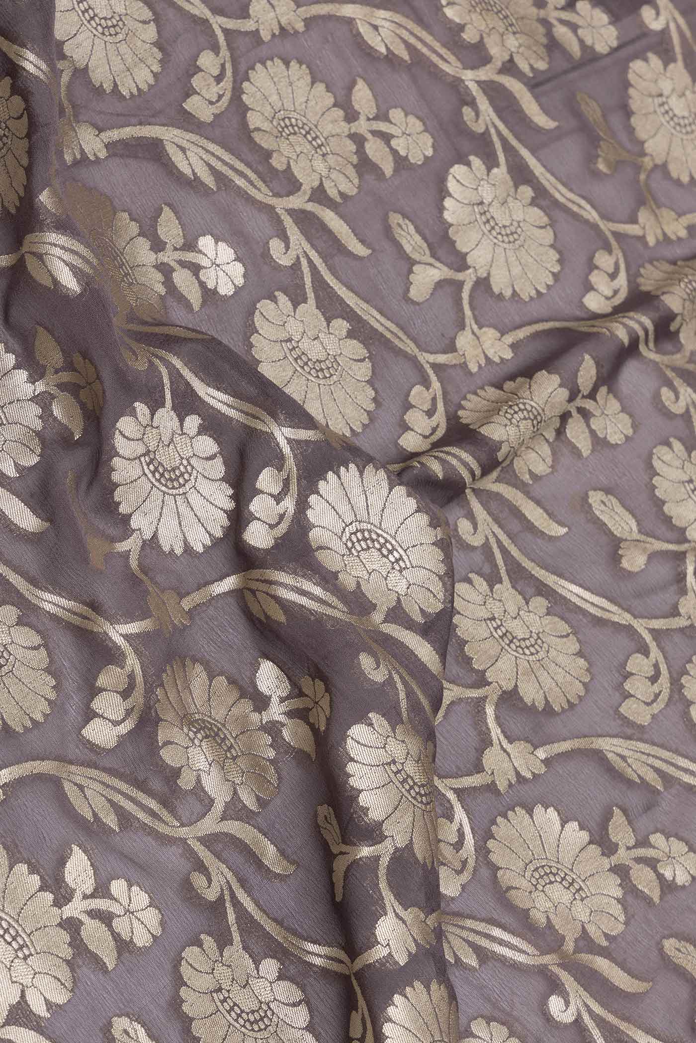 Close up of Brown Dual Tone Blended Banarasi Georgette Saree with Zari Brocade on the body and Zari Border displaying folds