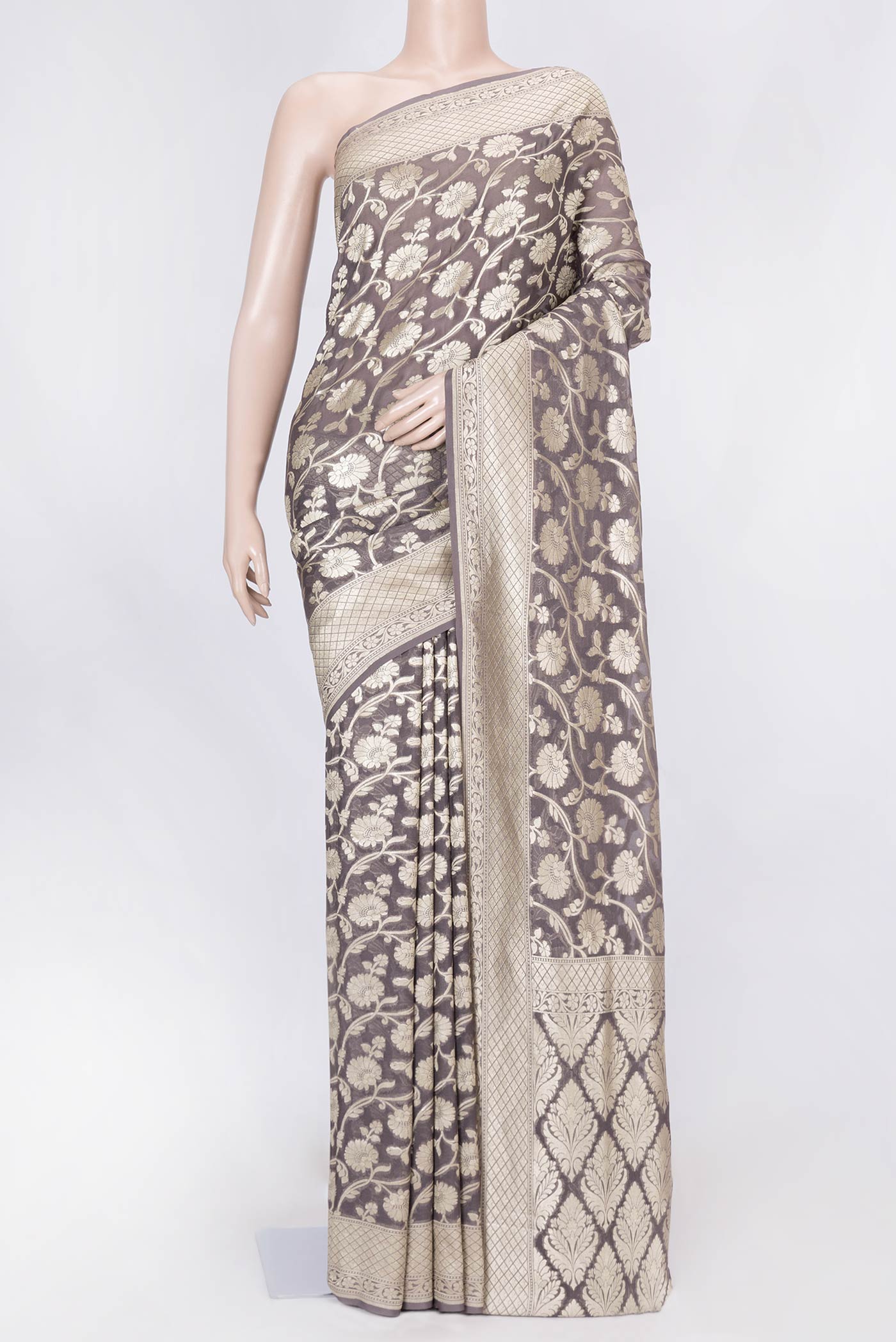 Brown Dual Tone Blended Banarasi Georgette Saree with Zari Brocade on the body and Zari Border displayed on a mannequin