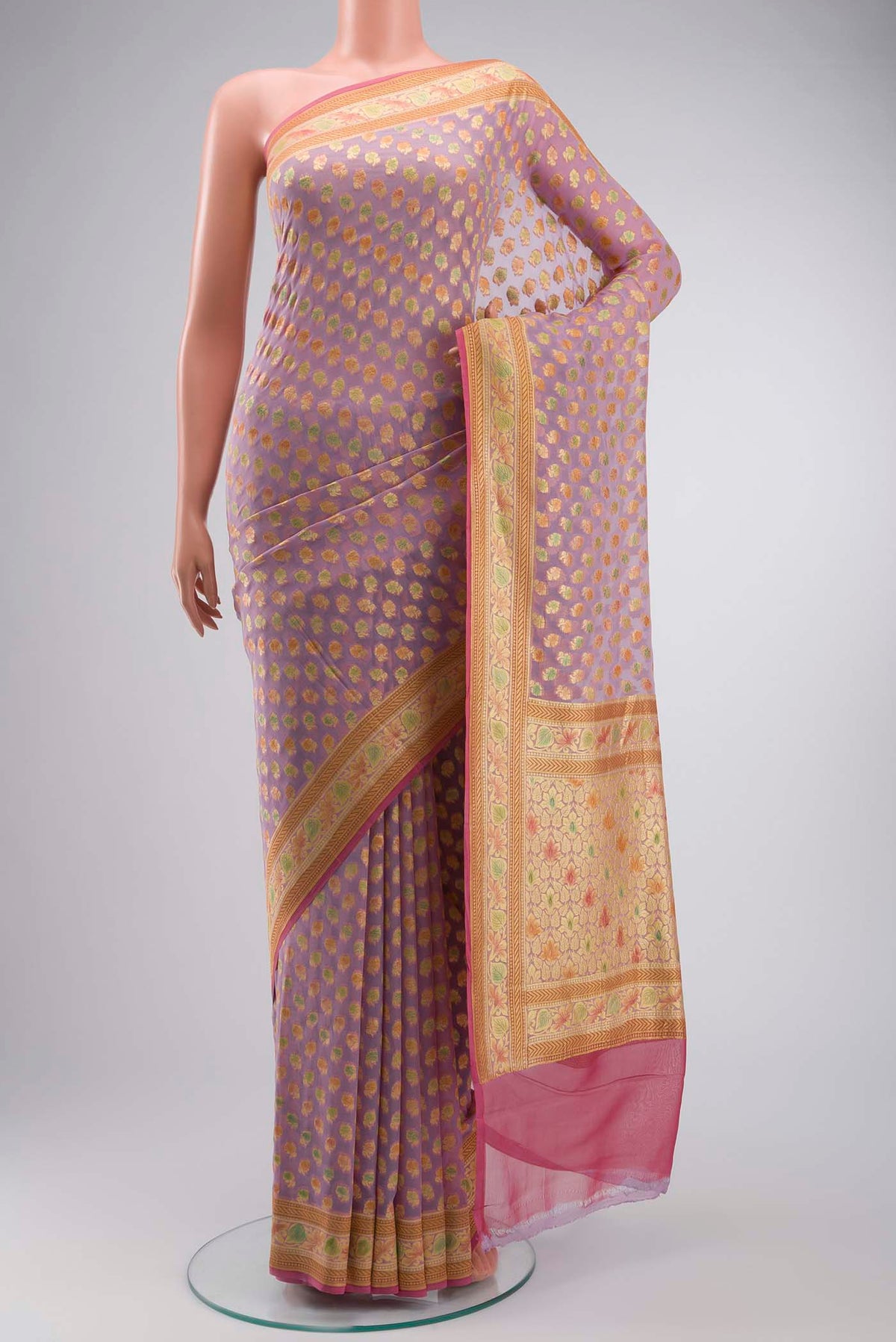 Lavender Banarasi Georgette Saree with Zari Butta on the body and Zari Border displayed on a mannequin