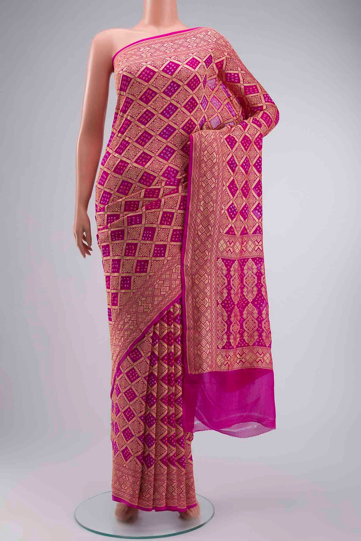 Pink Banarasi Georgette Saree with Bandhani Print on the body and Zari Border displayed on a mannequin