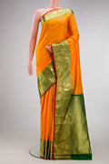 Mustard Dual Tone Gadwal Silk Saree with Zari And Thread Butta on the body and Zari Border.  displayed on a mannequin