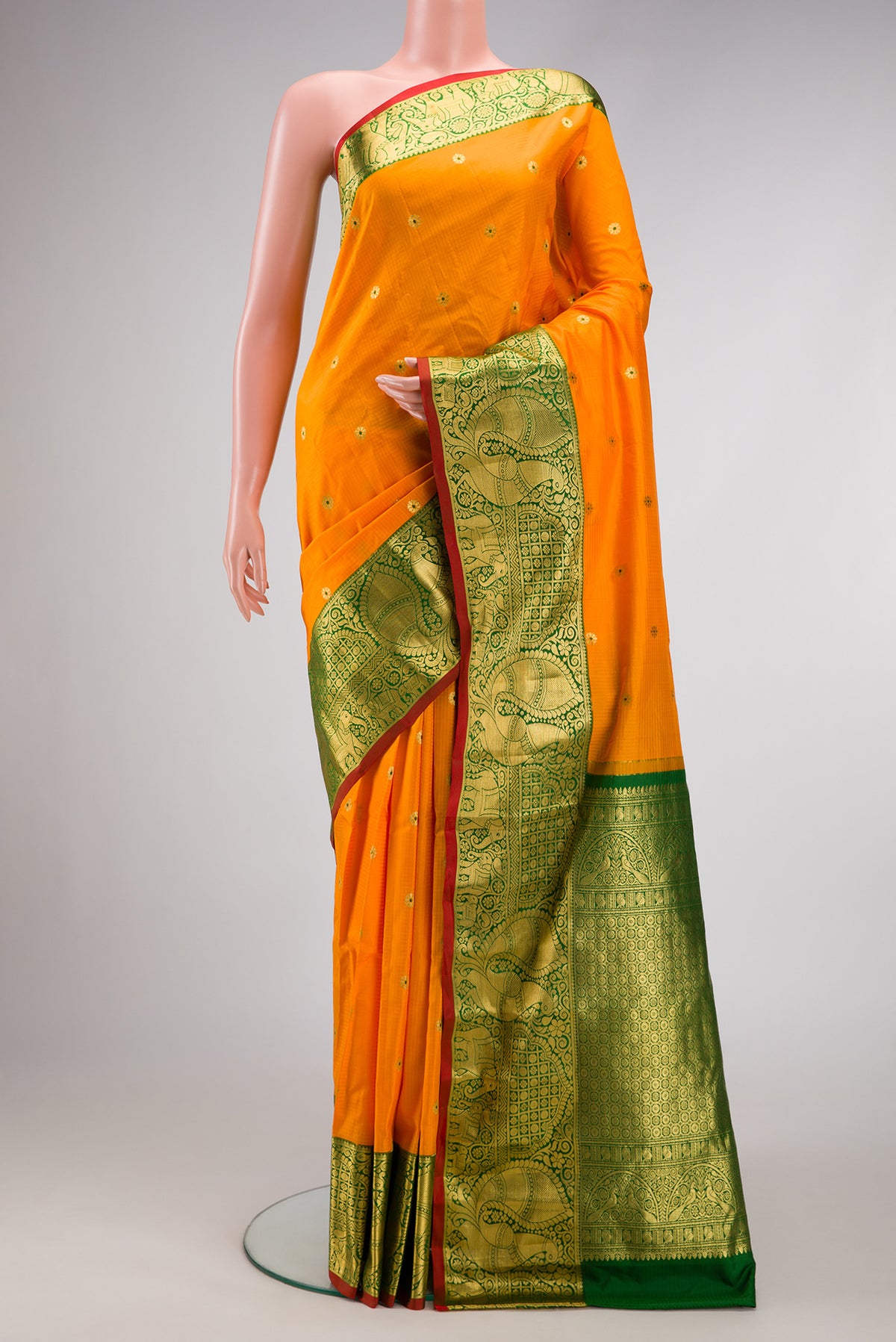 Mustard Dual Tone Gadwal Silk Saree with Zari And Thread Butta on the body and Zari Border.  displayed on a mannequin