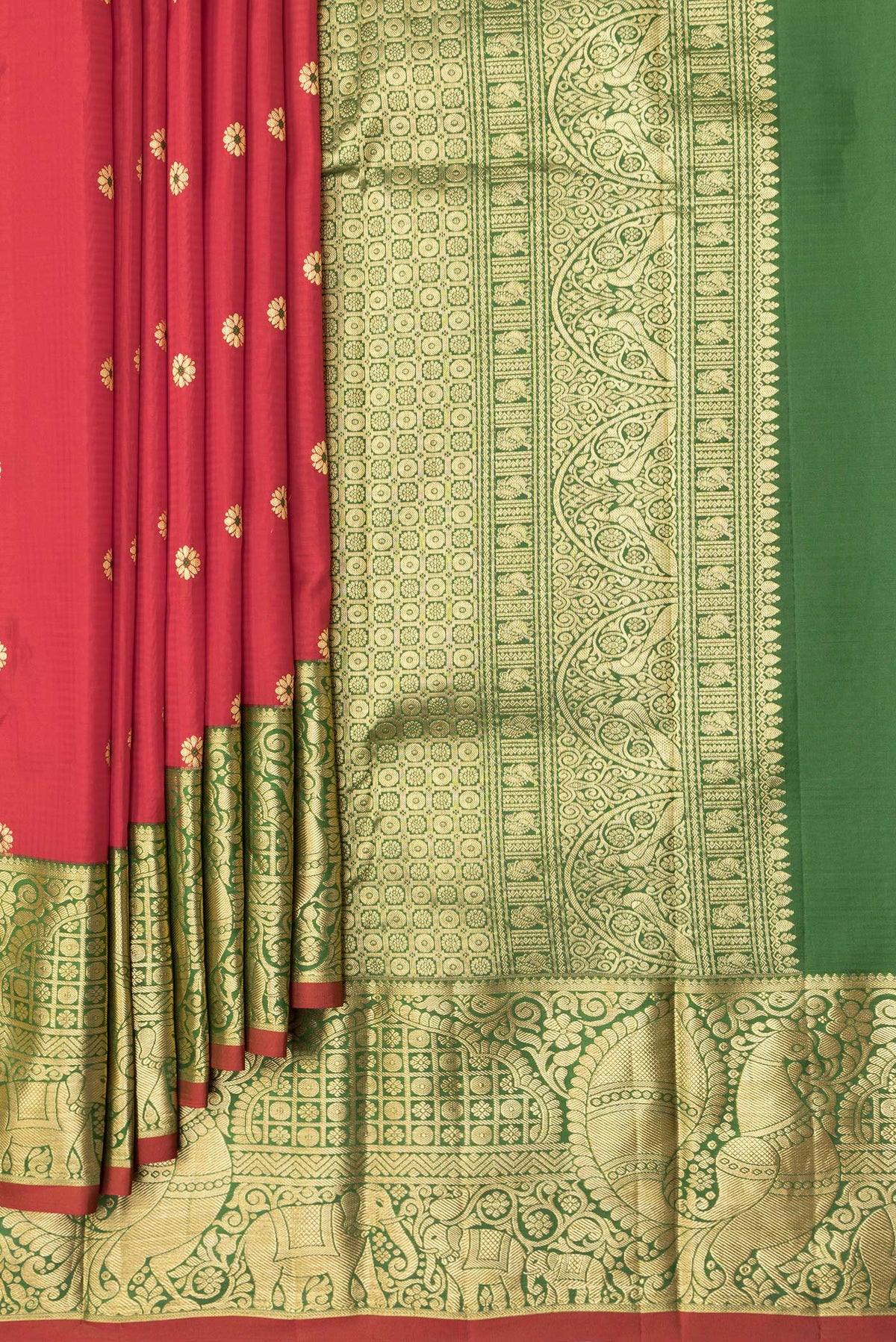 Pleats and pallu of Red Dual Tone Kanchipuram Silk Saree with Zari And Thread Butta on the body and Zari Border. 
