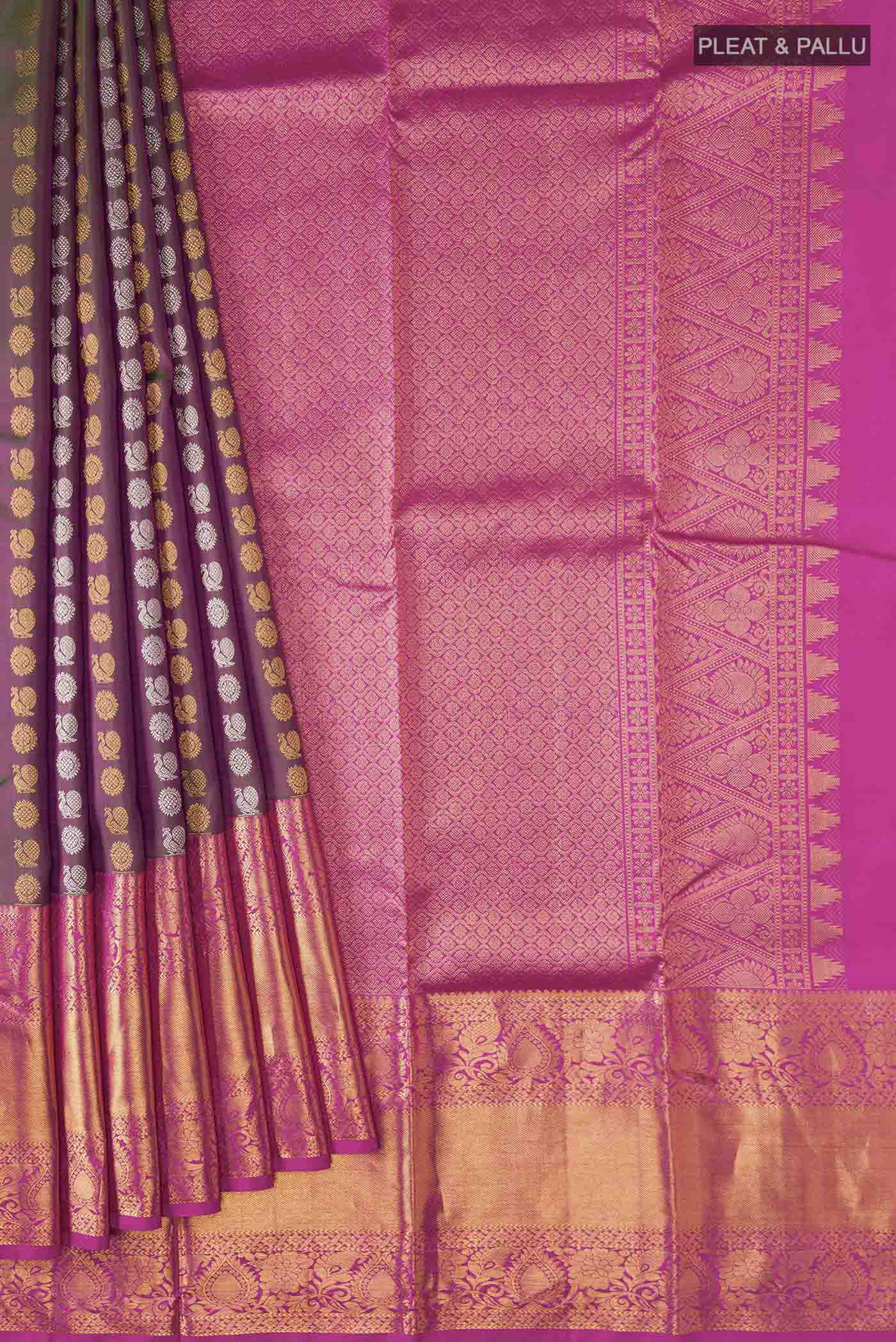 Pleats and pallu of Green with Pink Color Kanchipuram Silk Saree with Zari Butta on the body and Zari Border