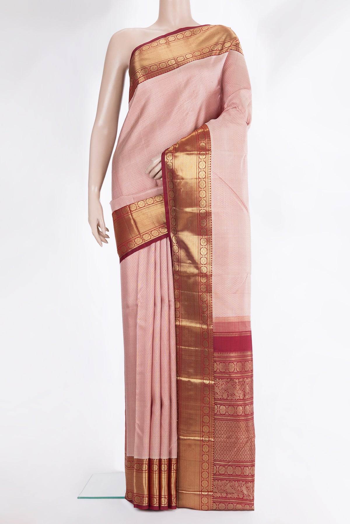 Pure Silk Pure Zari Peach Dual Tone Kanjivaram Saree with Jacquard design on the body and Zari Border.  displayed on a mannequin