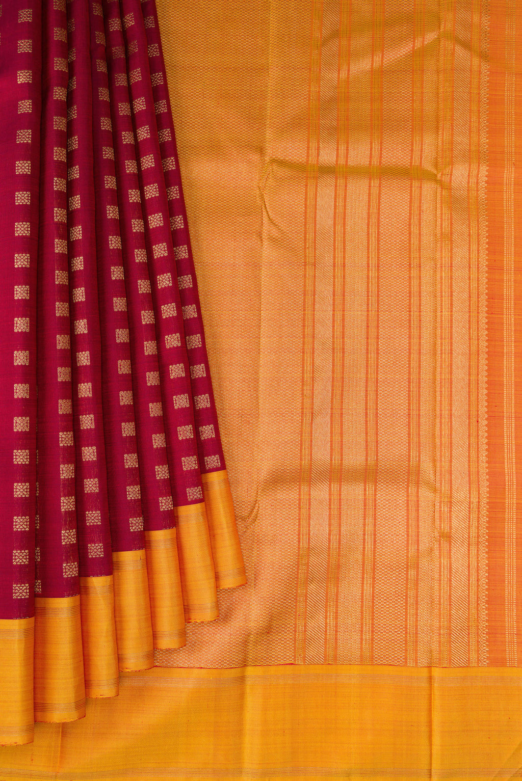 Pleats and pallu of Pure Silk Pure Zari Maroon Kanchipuram Saree with Zari Butta on the body and Plain Border. 