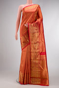 Pure Silk Pure Zari Red Dual Tone Kanjivaram Saree with Zari Brocade on the body and Zari Border.  displayed on a mannequin