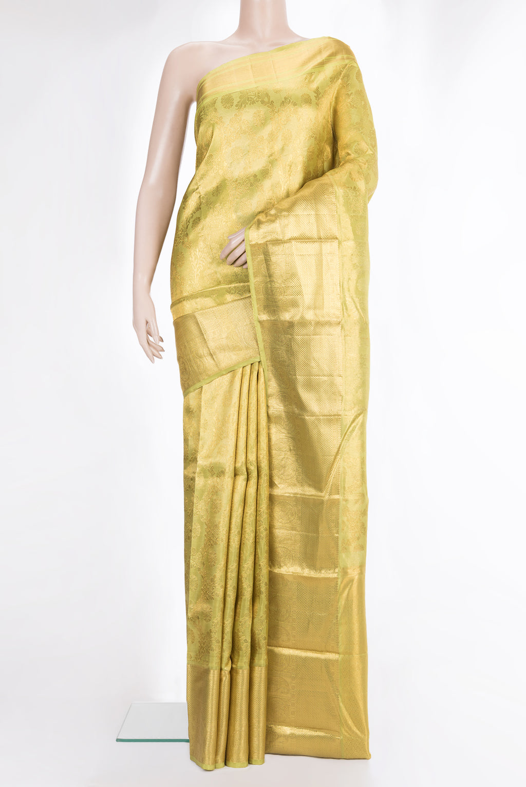 Gold Kanchipuram Tissue Saree with Zari Brocade on the body and Zari Border.  displayed on a mannequin