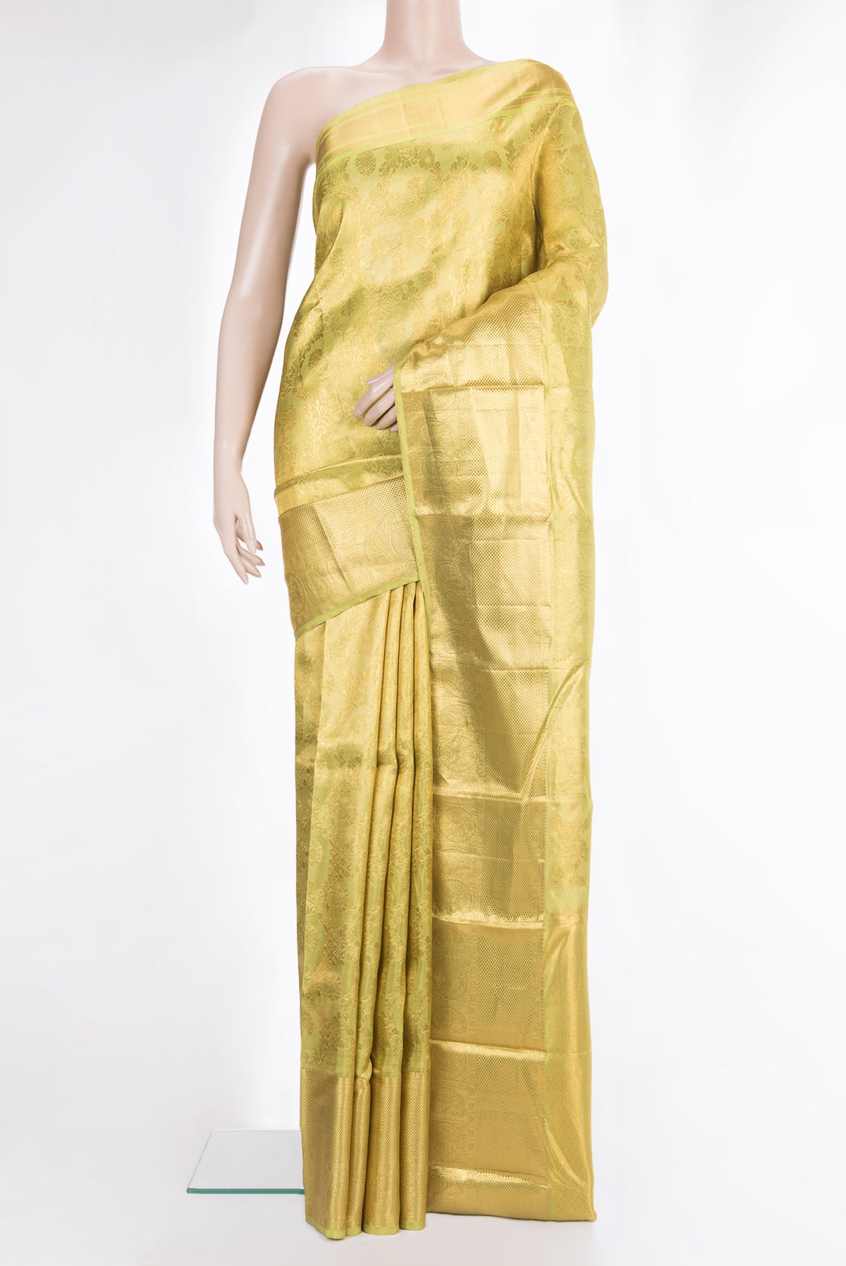 Gold Kanchipuram Tissue Saree with Zari Brocade on the body and Zari Border.  displayed on a mannequin