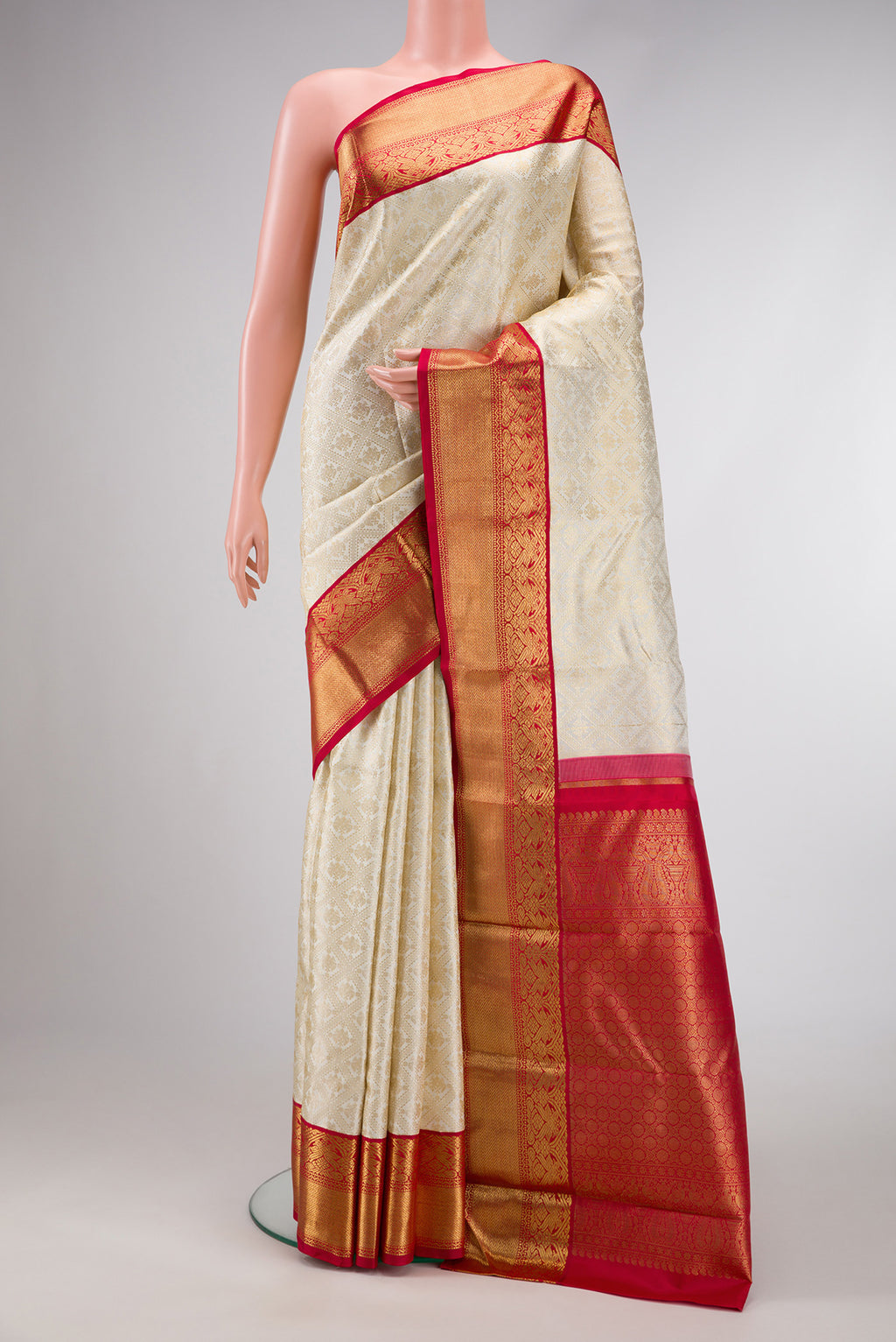 Pure Silk Pure Zari Off White Dual Tone Kanjivaram Saree with Zari Brocade on the body and Zari Border.  displayed on a mannequin