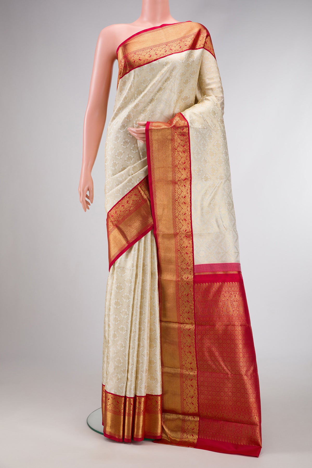 Pure Silk Pure Zari Off White Dual Tone Kanjivaram Saree with Zari Brocade on the body and Zari Border.  displayed on a mannequin