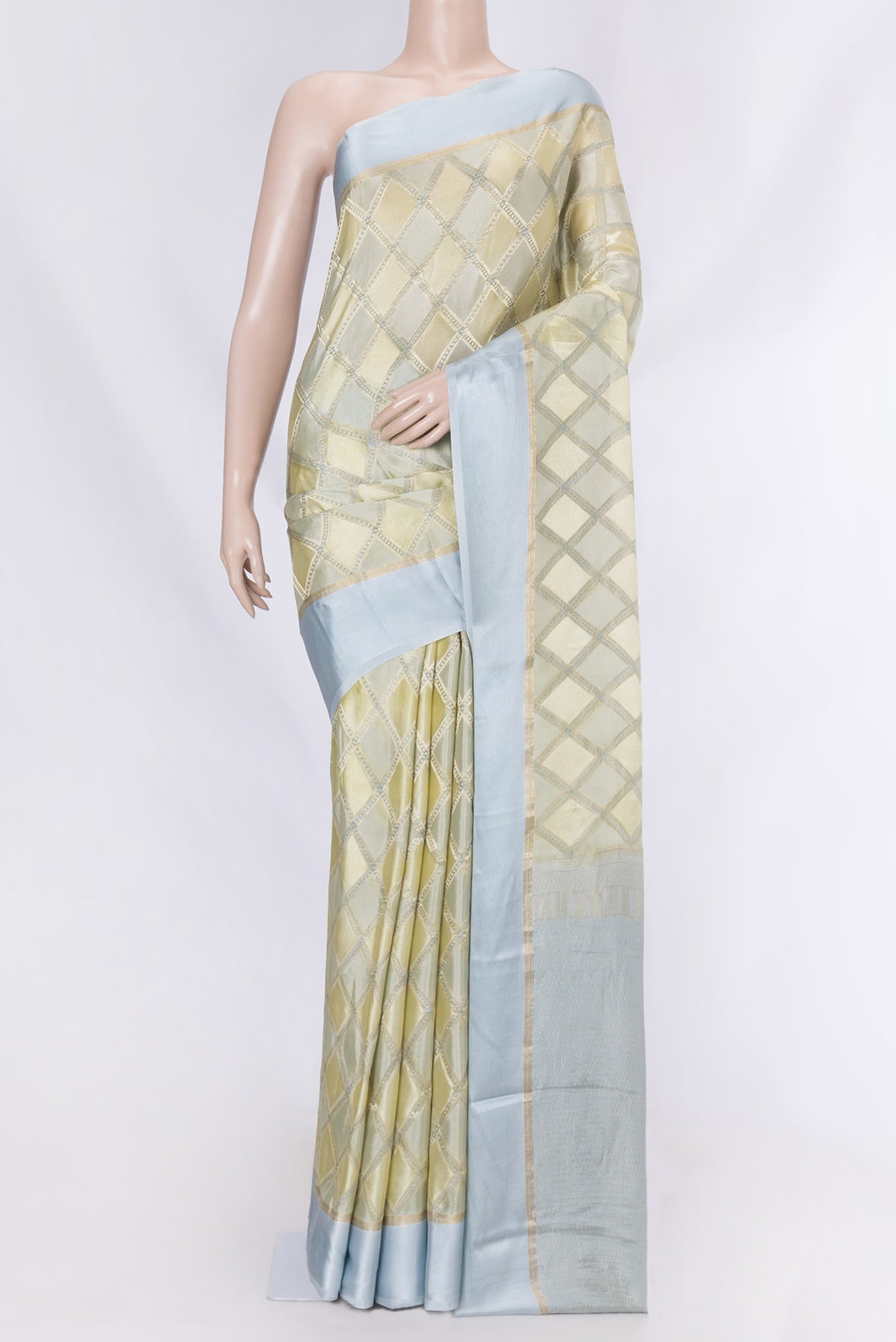 Sandal Dual Tone Georgette Saree with Checked design on the body and Zari Border displayed on a mannequin