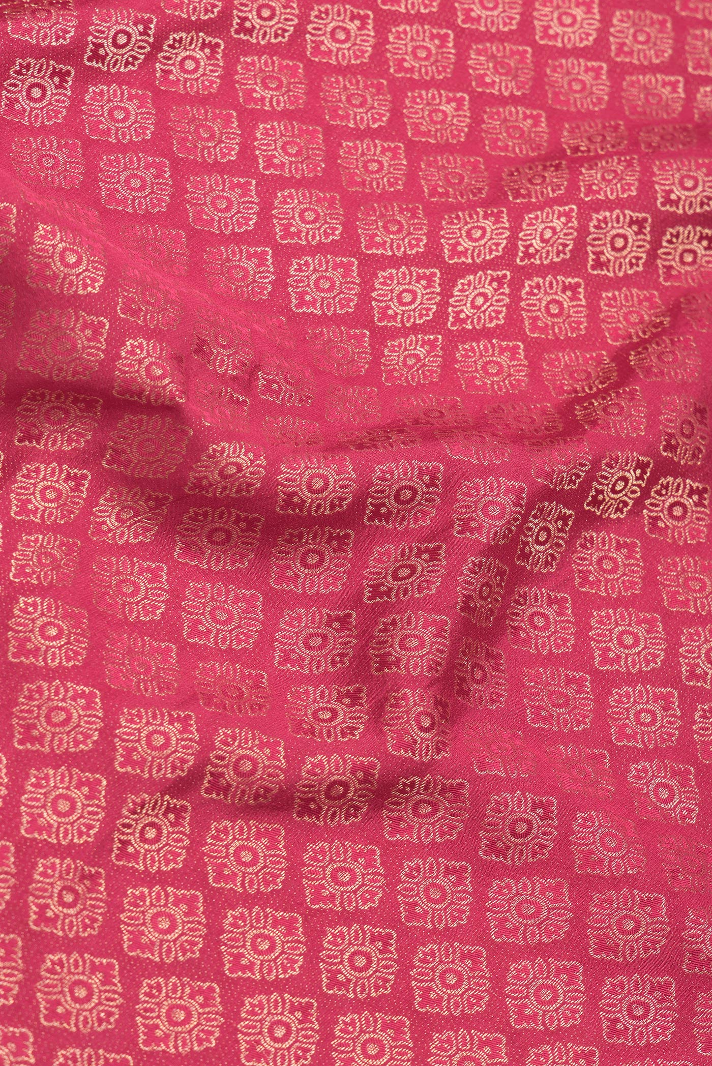 Close up of Pink Dual Tone Mysore Georgette Saree with Zari Brocade on the body and Zari Border.  displaying folds