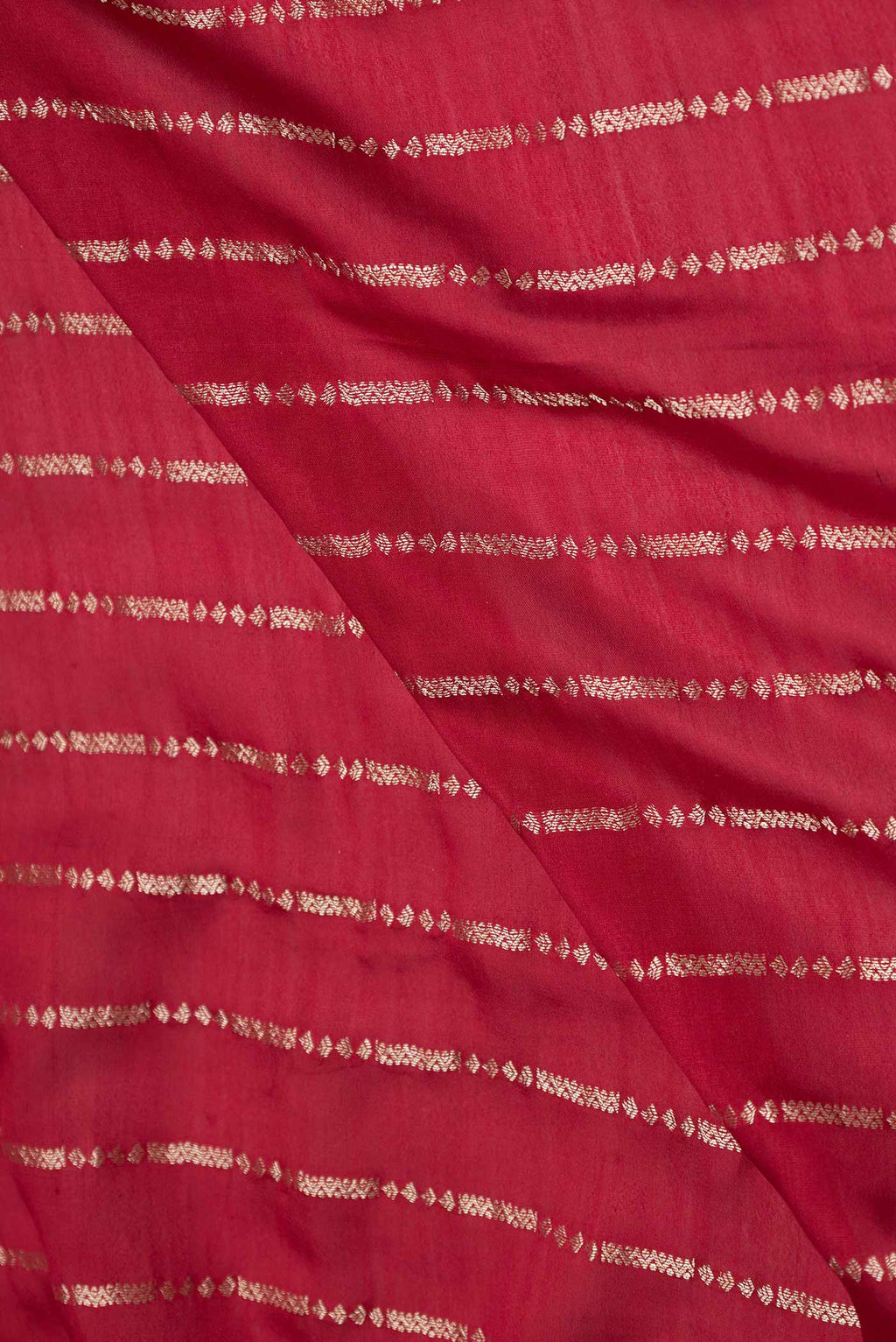 Close up of Maroon Mysore Crepe Saree with Stripes on the body and Fancy Border displaying folds