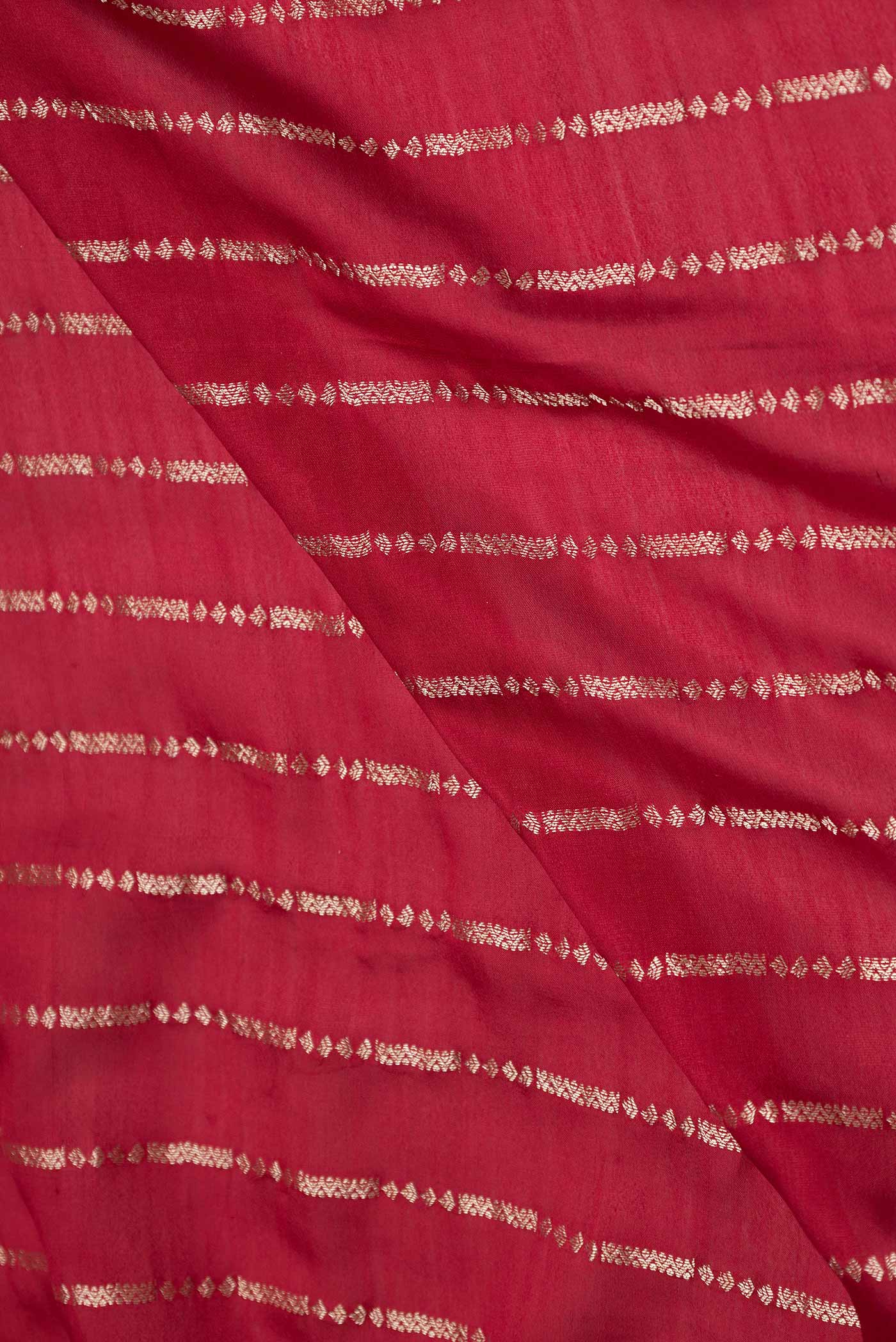 Close up of Maroon Mysore Crepe Saree with Stripes on the body and Fancy Border displaying folds