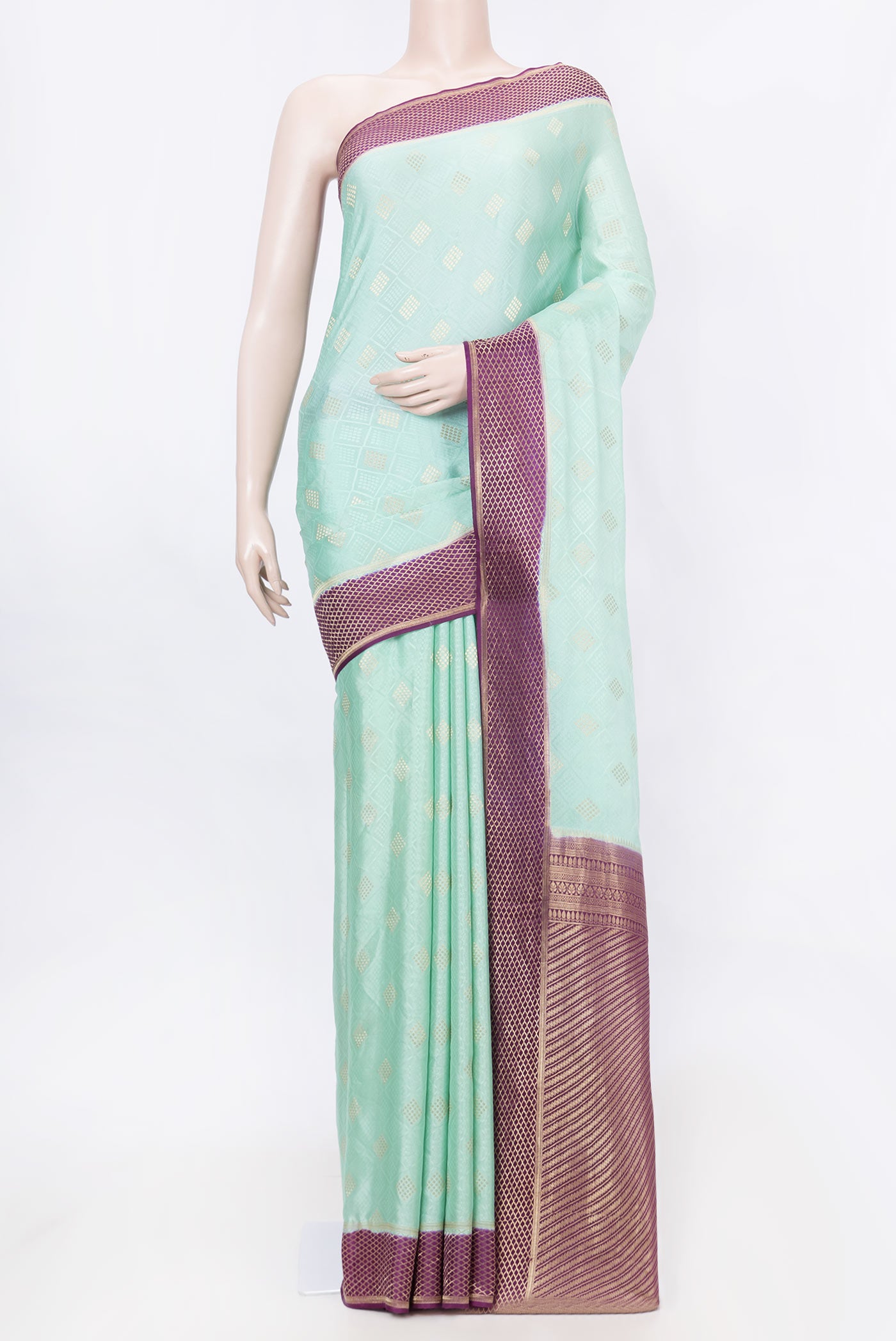 Sea Green Dual Tone Mysore Crepe Saree with Jacquard With Zari Butta on the body and Zari Border displayed on a mannequin