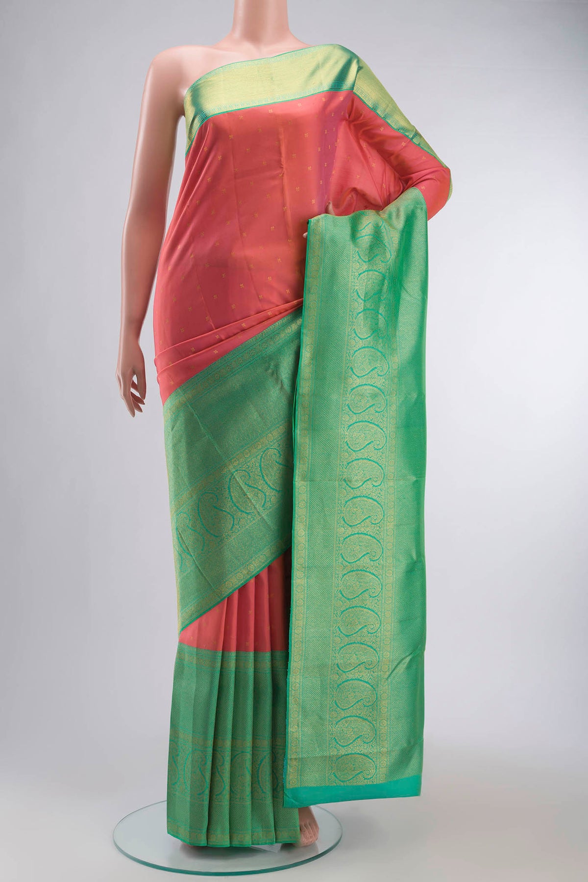Pink Kanchipuram Silk Saree with Zari Butta on the body and Zari Border displayed on a mannequin